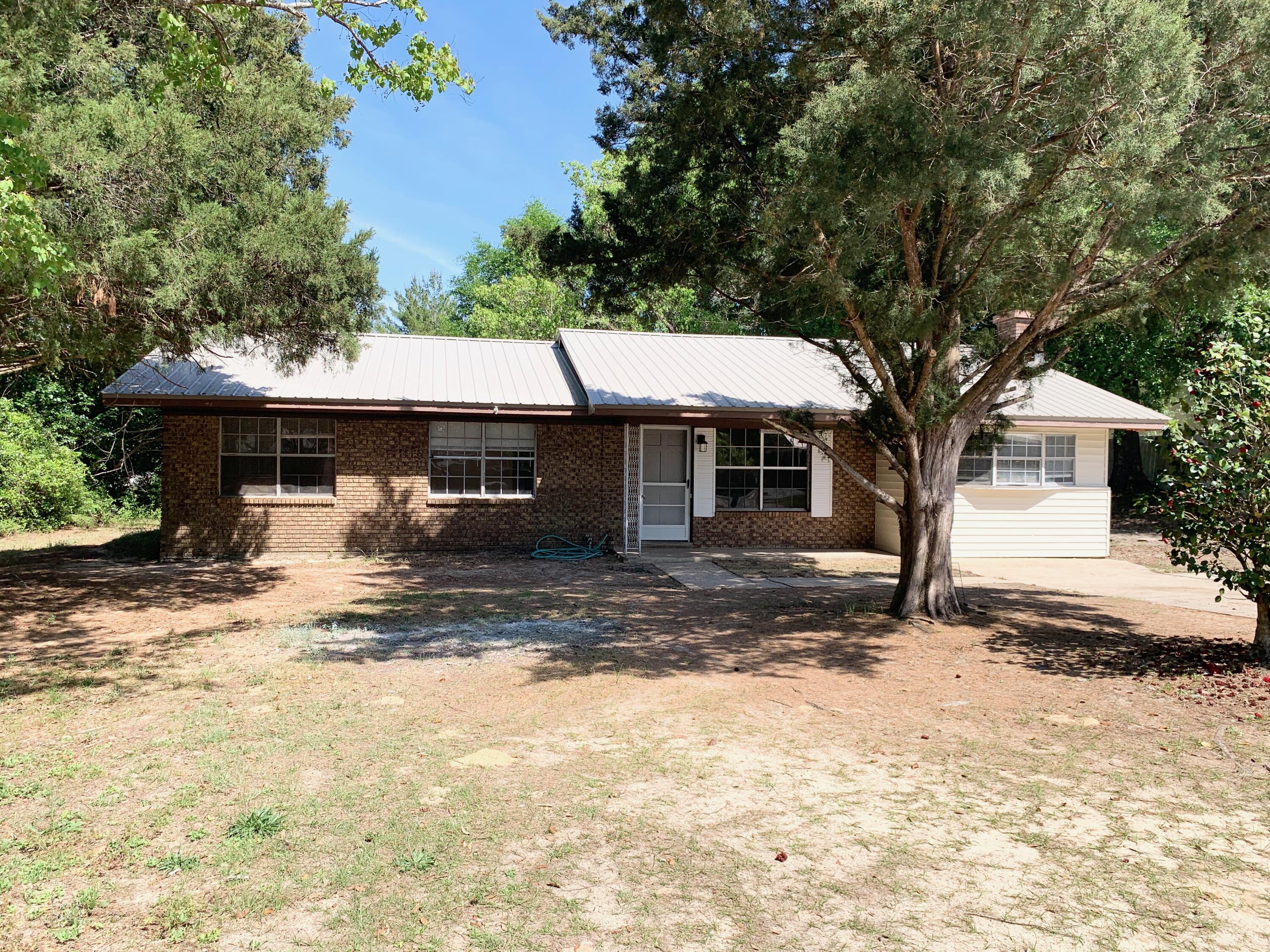Discover the Best Small Town in Florida!

Experience the perfect blend of historic charm and modern convenience in this highly desired location. Situated on Juniper Lake Road, this property puts you in the heart of DeFuniak Springs, voted ''Best Small Town in Florida.'' Whether you are looking for a peaceful primary residence or a savvy investment, this location offers a lifestyle of recreation and relaxation.

The lot will be divided at closing. HOWEVER, for an additional $20,000, you can secure the entire lot! Keep the extra space for a massive backyard or hold it as an investment.

Prime Location: Just minutes from Walton High School and the vibrant downtown district.

Buyer to verify all dimensions and pertinent information. Coastal & Spring Access: Enjoy the best of both worlds. You are a short drive from the sugar white sands of the Emerald Coast and just moments away from the crystal clear waters of Ponce De Leon Springs, the ultimate way to cool off on warm summer days.

Community & Lifestyle
Living here means being part of a community rich in history and natural beauty, including: Lake DeFuniak: Take a stroll around one of the world's almost perfectly circular lakes, featuring a scenic one mile perimeter path; Festivals & Culture: The downtown area and Lake DeFuniak serve as the hub for local festivals, farmer's markets, and holiday events; and an Outdoor Paradise: From lake life to beach days and natural spring hopping, your weekends are officially set.