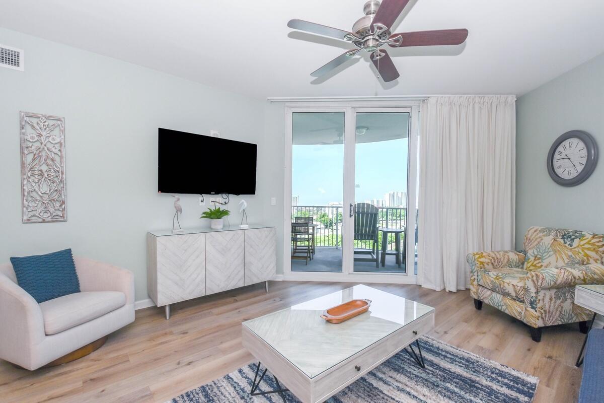 Meticulously maintained 2-bedroom junior suite at the highly sought-after Palms of Destin Resort, situated on 15 acres in the heart of Destin. This 9th-floor unit offers beautiful Gulf views, sweeping views of the Destin skyline, and unforgettable Emerald Coast sunsets from a spacious private balcony. Enjoy watching boats come and go throughout the day from this elevated vantage point. The unit comes fully furnished with updated décor and features a well-appointed kitchen with new stainless steel appliances, granite countertops, and attractive cabinetry. Major upgrades include a HVAC system and water heater. HOA fees cover ALL utilities, including electricity, making ownership simple and cost-effective. Click for the full Remarks... Resort-style amenities include one of the largest lagoon-style pools in Destin with waterfalls and bridges, hot tub, kiddie pool and splash pad, fitness center, playground, tennis, pickleball, basketball courts, picnic and grilling areas, and covered parking. Ideal as a primary residence, second home, or income-producing vacation rental. The Palms of Destin offers true resort living with lush tropical landscaping and a central location close to Destin's beaches, dining, shopping, and entertainment. The expansive lagoon-style pool serves as the centerpiece of the community, creating a relaxing and family-friendly atmosphere.
The primary bedroom features a coastal-style king bedroom set, ensuite bathroom, and direct balcony access. The second bedroom offers bunk beds (full size!) behind a charming barn-style door, its own private bathroom, and a conveniently located stackable washer and dryer closet.
The open living and dining area flows seamlessly to the balcony, maximizing natural light and indoor-outdoor living. With extensive amenities, covered parking, and utilities included in the HOA, this unit provides exceptional value and low-maintenance ownership in one of Destin's most popular resort communities.