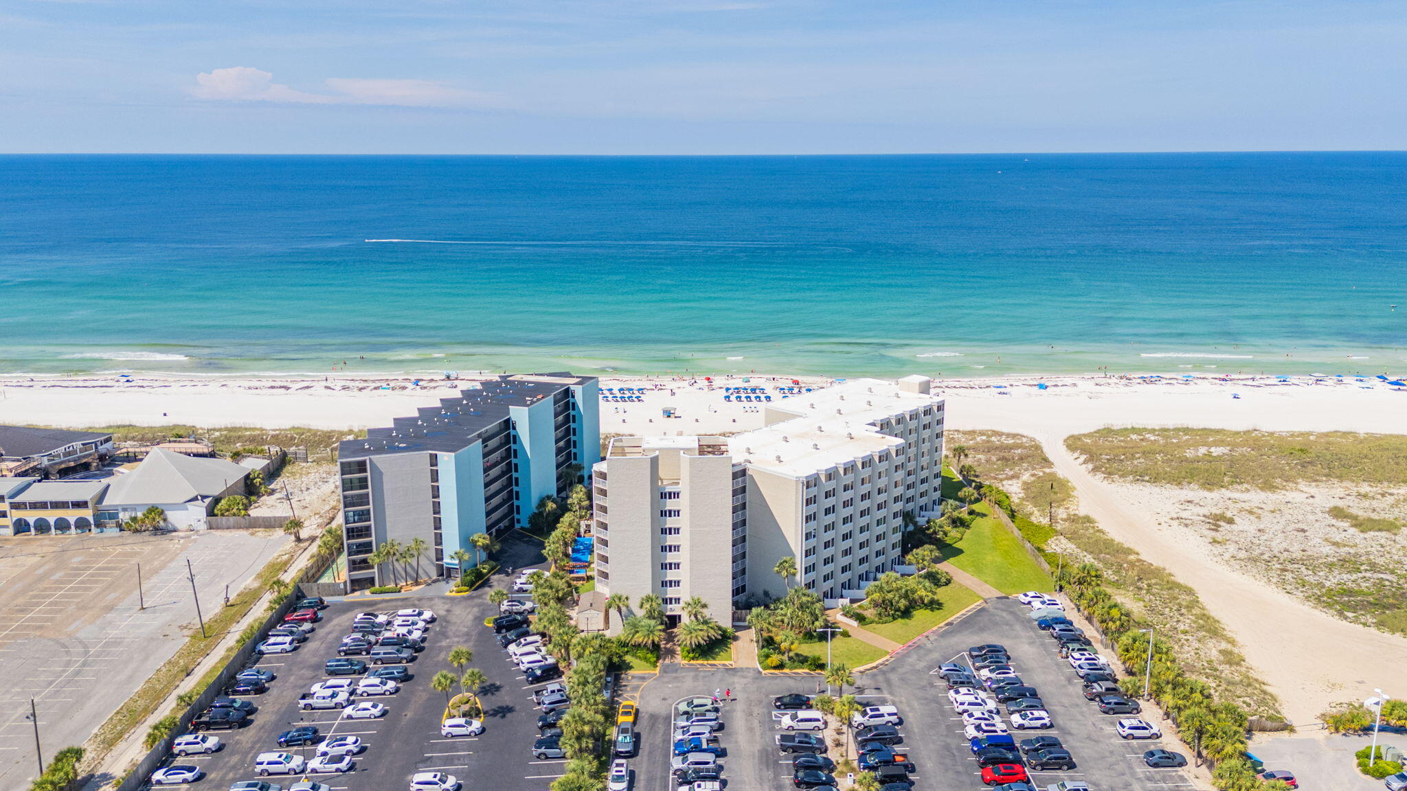 Experience the ultimate beachfront lifestyle at Top of the Gulf, one of Panama City Beach's most desirable Gulf-front communities.  Directly on the sugar-white sands of the Emerald Coast, your | updated | coastal retreat offers Gulf views, spectacular sunrises and sunsets, and private beach access steps from your door.  Spend the days swimming, paddleboarding, shell collecting, or explore along miles of pristine shoreline.  After hours, loosen up watching waves crash from the massive communal balconies, or hit a few balls at 'TopGolf', six miles west.  

Resort-style amenities include a Gulf-front swimming pool, kids' pool, private beach access, fitness center, game room, owners' lounge, BBQ and picnic areas, beachside snack & drink bar, shuffleboard, and Wi-Fi throughout.  Community upgrades, including elevators, windows, doors, railings, and walkways, add to the property's value and appeal.  Take advantage of a low cost monthly HOA fee, at just $525.00.

Time is the ultimate currency here; ideally located on the west end of Thomas Drive, you're minutes from restaurants, shopping, marinas, golf, and many iconic attractions.  Walk to Pineapple Willy's, enjoy live music beachfront at Tootsies new Orchid Lounge, savor Gulf seafood, or explore St. Andrews State Park.  Walmart, bakery, dining, gas and ice cream - all walkable.  Whether you seek a getaway, investment, or your own beachfront home, Top of the Gulf offers a tempting combination of location, amenities, and efficiency.