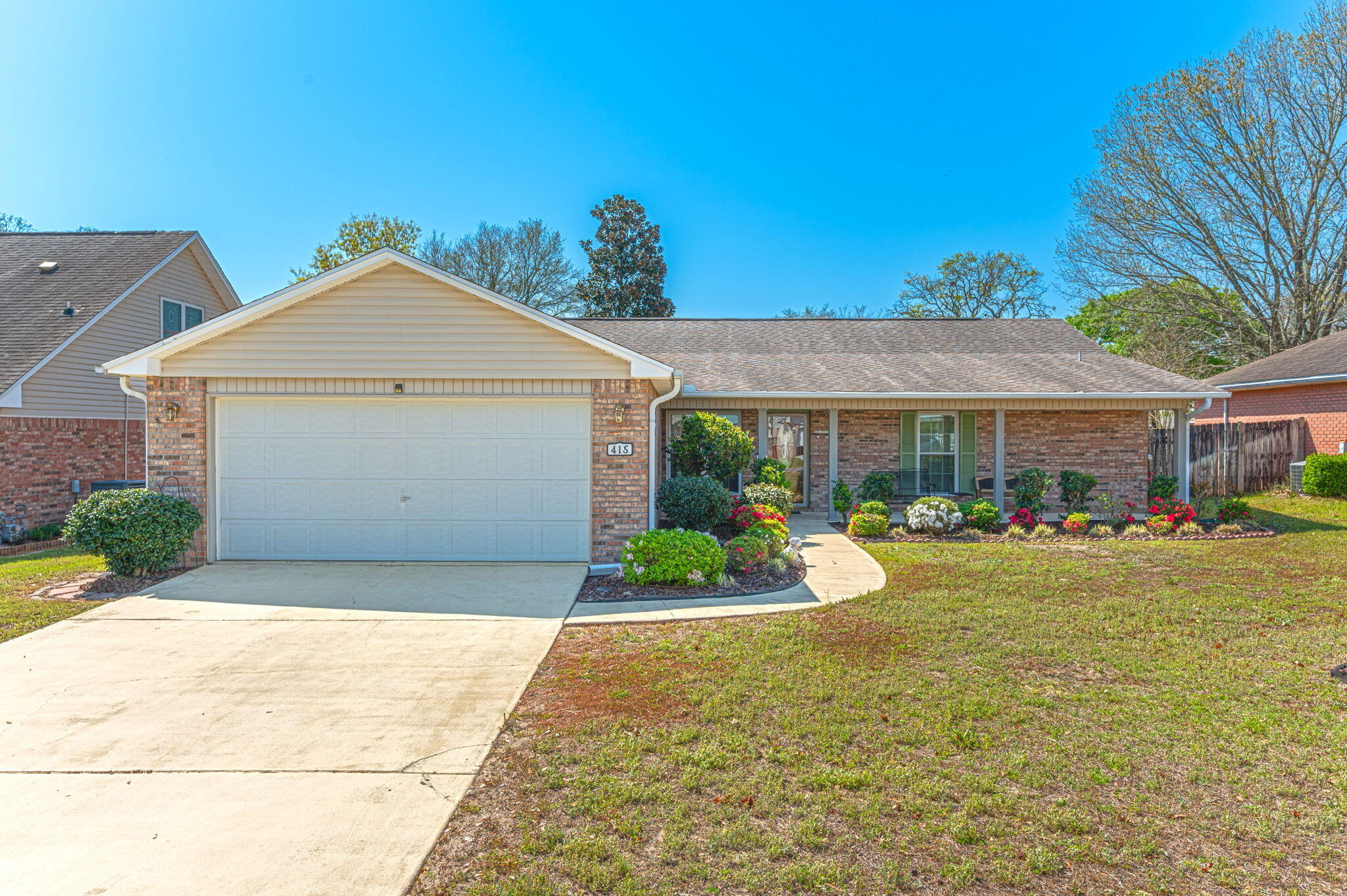 Exceptionally well-maintained home with outstanding curb appeal, ideally located on a quiet cul-de-sac. This property offers a functional split-bedroom floor plan designed for comfort and privacy. The kitchen features stainless steel appliances, a breakfast bar, and an eat-in area, along with a separate dining room for added entertaining space. Wood laminate flooring runs throughout the main living areas, complemented by a cozy fireplace. Enjoy year-round use of the heated and cooled sunroom. Additional features include a fenced-in yard, garage with auto opener, 2020 tankless water heater, 2013 roof, and 2020 HVAC system. Full yard irrigation system and home warranty paid through 2028! Move-in ready and meticulously cared for throughout.