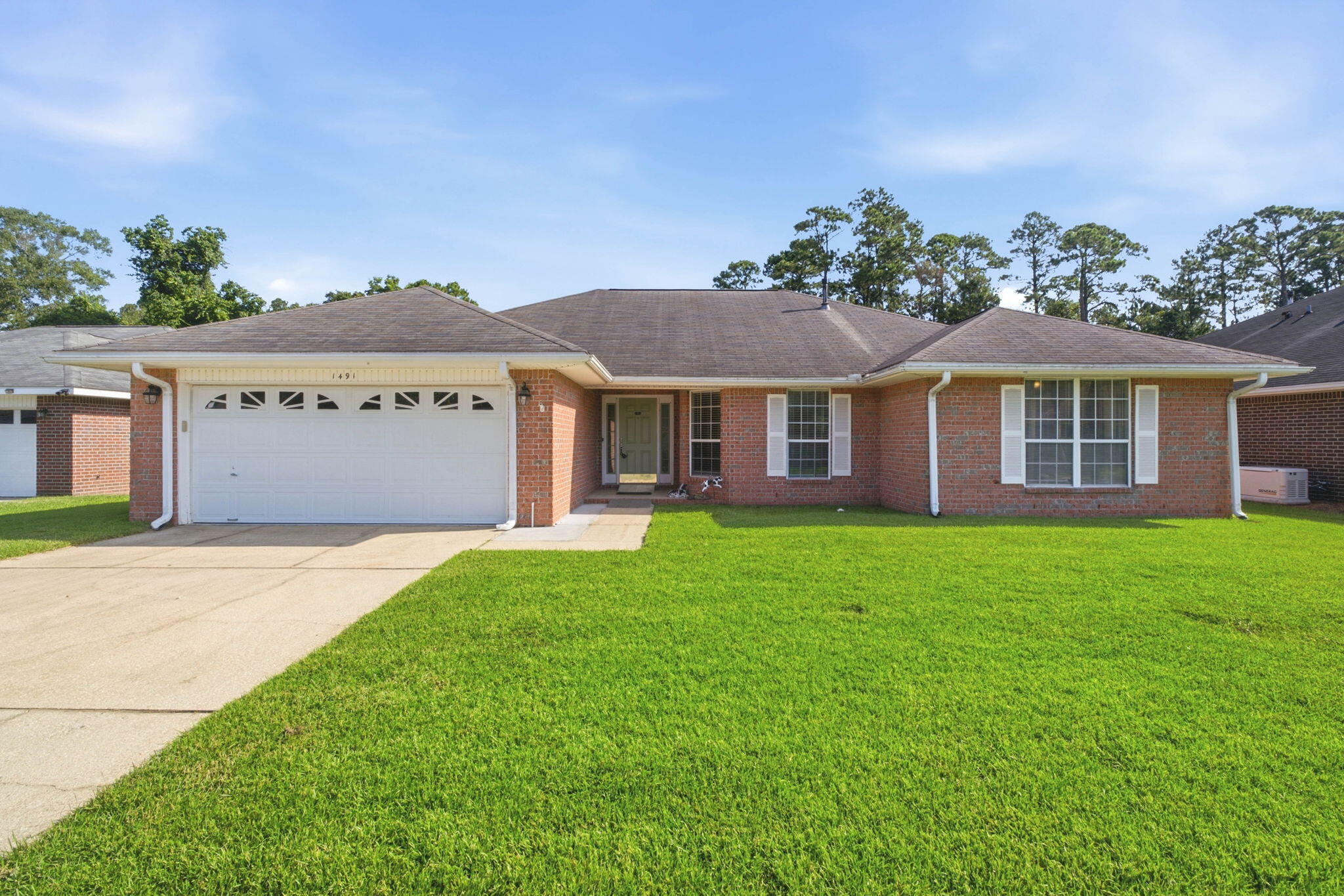 Welcome home to this 3 bedroom, 2 bathroom brick home nestled in the Lillian Woods neighborhood in Southwest Pensacola - located just minutes away from the Naval Hospital Pensacola, NAS Pensacola, and Corry Station! Offering a generous 2,282 Sqft of living space - including a formal dining room/office space, large great room centered around a cozy gas fireplace, a spacious chef's kitchen with center island and pantry, indoor laundry and utility room, and a climate controlled Florida room for year long backyard entertainment! The primary suite features an oversized closet and its own ensuite bathroom with double vanity, water closet, and walk-in shower. Outside, the extended concrete patio is ready to be the backdrop for your next backyard BBQ, garden bed, and your al fresco dining spot in your fully fenced-in backyard - with plenty of room for you to install a pool! Schedule your showing today!