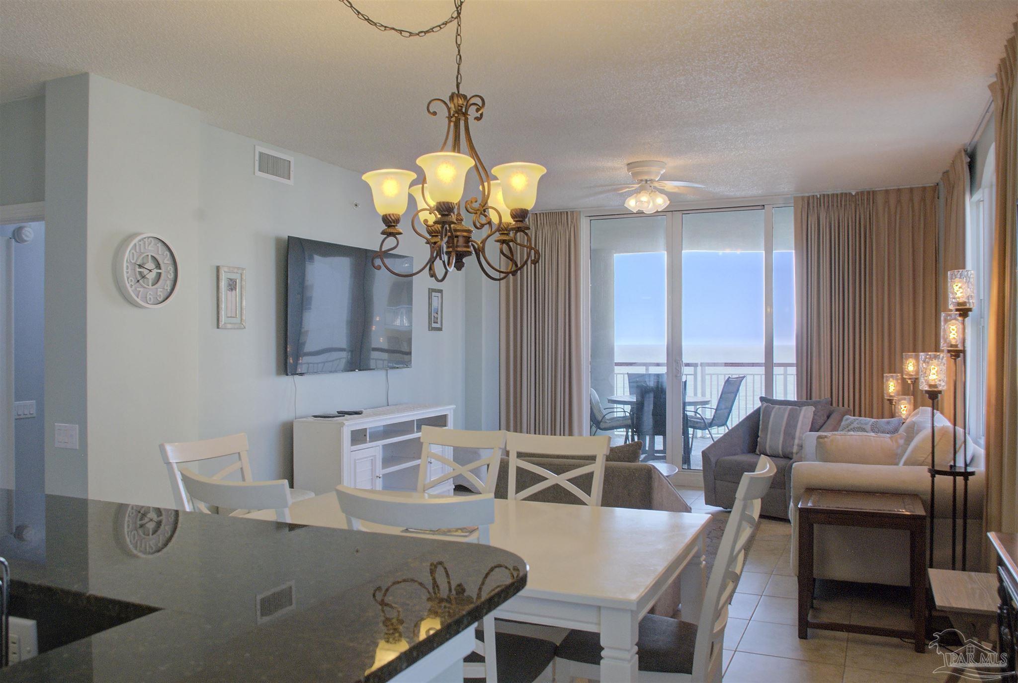 Discover an unparalleled opportunity to own a luxurious, turn-key residence at the exclusive, gated Beach Colony Resort. This remarkable 3-bedroom, 3-bathroom corner unit delivers breathtaking, miles-long Gulf views and offers water views from every single room, including stunning vistas of Navarre Beach and Santa Rosa Sound. Offered fully furnished with all conveying appliances, this unit is perfectly positioned for a stellar investment property or an elegant owner-occupied home.
Enjoy an expansive, open-concept floorplan filled with natural light. Tile floors, three balconies, including a large, covered Gulf-facing corner balcony accessible from both the great room and the primary suite, plus two smaller front balconies.