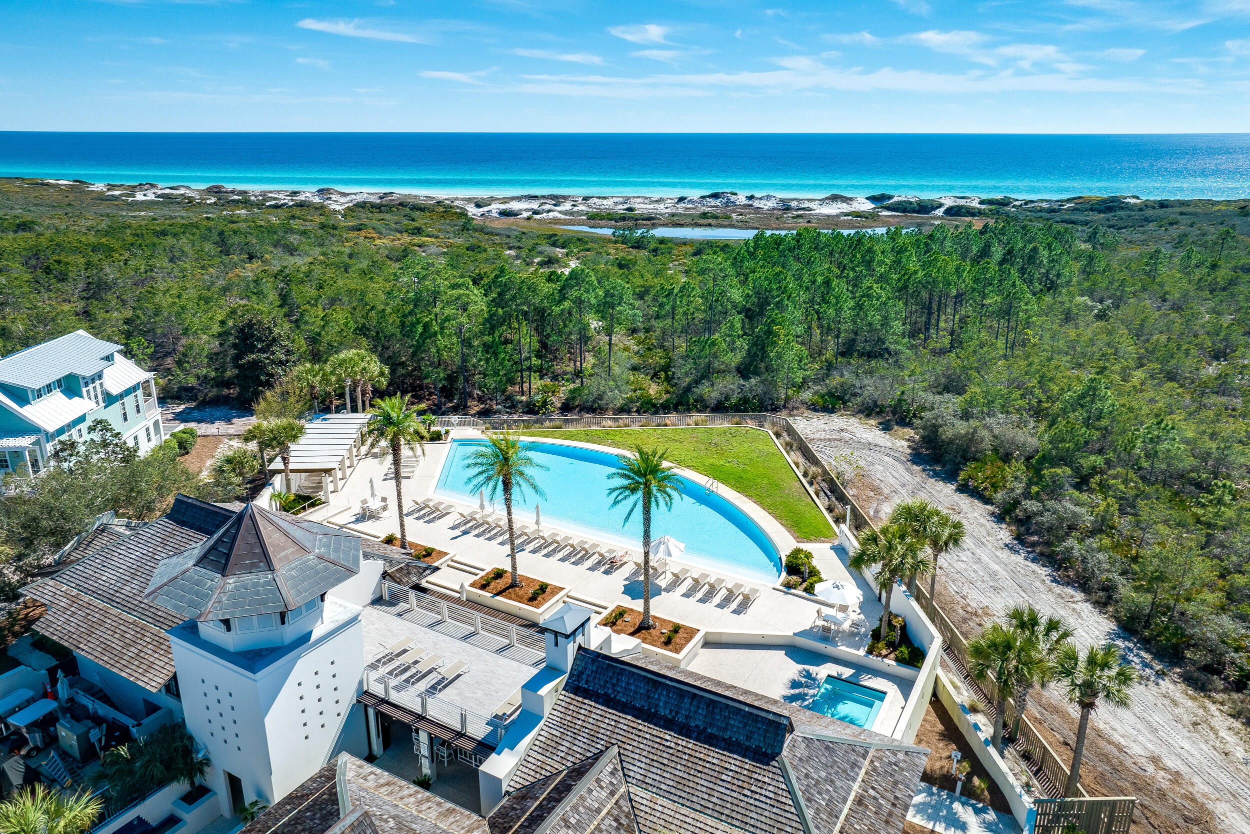 Discover an extraordinary blend of luxury, comfort, and coastal elegance at 69 Cypress Dunes, ideally situated within one of the area's most exclusive gated communities. Spanning 3,564 square feet, this exceptional modern residence offers four bedrooms, a private study, and four-and-a-half beautifully designed bathrooms, all curated with sophisticated contemporary finishes and impeccable attention to detail.

From the moment you enter the grand foyer, the home welcomes you with an atmosphere of refined sophistication and effortless style. Designed with entertaining in mind, the second floor serves as the heart of the home, showcasing an expansive living area highlighted by vaulted ceilings, custom drapery, a dramatic Venetian plaster fireplace, and a striking designer globe chandelier. Adjacent to the living room, the elegant dining space features a stylish bar complete with an ice maker and wine refrigerator, seamlessly flowing into the gourmet kitchen.

The chef's kitchen is both functional and stunning, appointed with sleek acrylic cabinetry, quartz countertops, a hidden appliance garage, and premium Thermador appliances. Just beyond, a spacious covered porch creates the perfect setting for outdoor dining and entertaining, complete with a Primo ceramic grill for effortless coastal gatherings. Located on the main level, the luxurious primary suite offers a private retreat with dual walk-in closets and a spa-inspired ensuite bath featuring double vanities, a soaking tub, and a separate walk-in shower. Two additional generously sized bedrooms are also located on this floor, including one currently designed as a fitness room that can easily function as a study, office, or additional bedroom. A thoughtfully positioned laundry room provides convenient access from the garage, ideal after a day spent enjoying the nearby beaches.

As the only Insulated Concrete Forms (ICF) home within Cypress Dunes, this residence offers superior durability, enhanced energy efficiency, and lasting peace of mind. Residents of Cypress Dunes enjoy an exceptional lifestyle with access to resort-style amenities, including two community pools, a jacuzzi, tennis courts, scenic walking trails, and tranquil cypress ponds. The Gulf-view pool provides a breathtaking backdrop for relaxing sunsets and coastal living at its finest.

Bordering a pristine State Park, 69 Cypress Dunes presents a rare opportunity to own a truly remarkable coastal retreat where luxury, privacy, and natural beauty come together seamlessly.