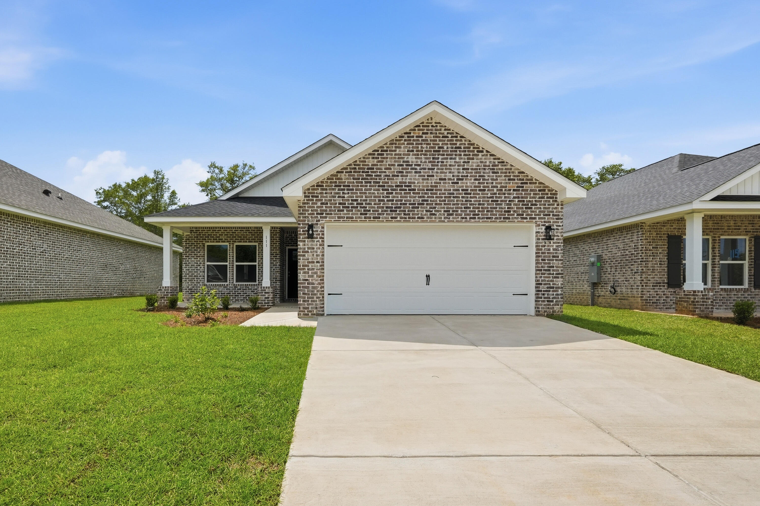 FLEXIBLE FOUR BEDROOM 'GEORGIA' PLAN Construction Complete!  All brick construction with finished 2-car-garage, landscaped yard.  Located in the new 'McCarthy Estates' S/D with easy access to Walton High School.  Seller will contribute up to $15,000 towards buyers closing costs/prepaids/rate buydown (call for details).  Neighborhood features include underground utilities, sidewalks, mailbox center and 1 beautiful street!  Cozy dining nook, breakfast bar w/seating, pantry + quartz countertops, family gathering room overlooks back porch, split bedroom plan.  Owner's suite has walk-in closet, double vanities, linen storage & shower only. Vinyl plank flooring in common areas, recessed lighting, raised ceilings.