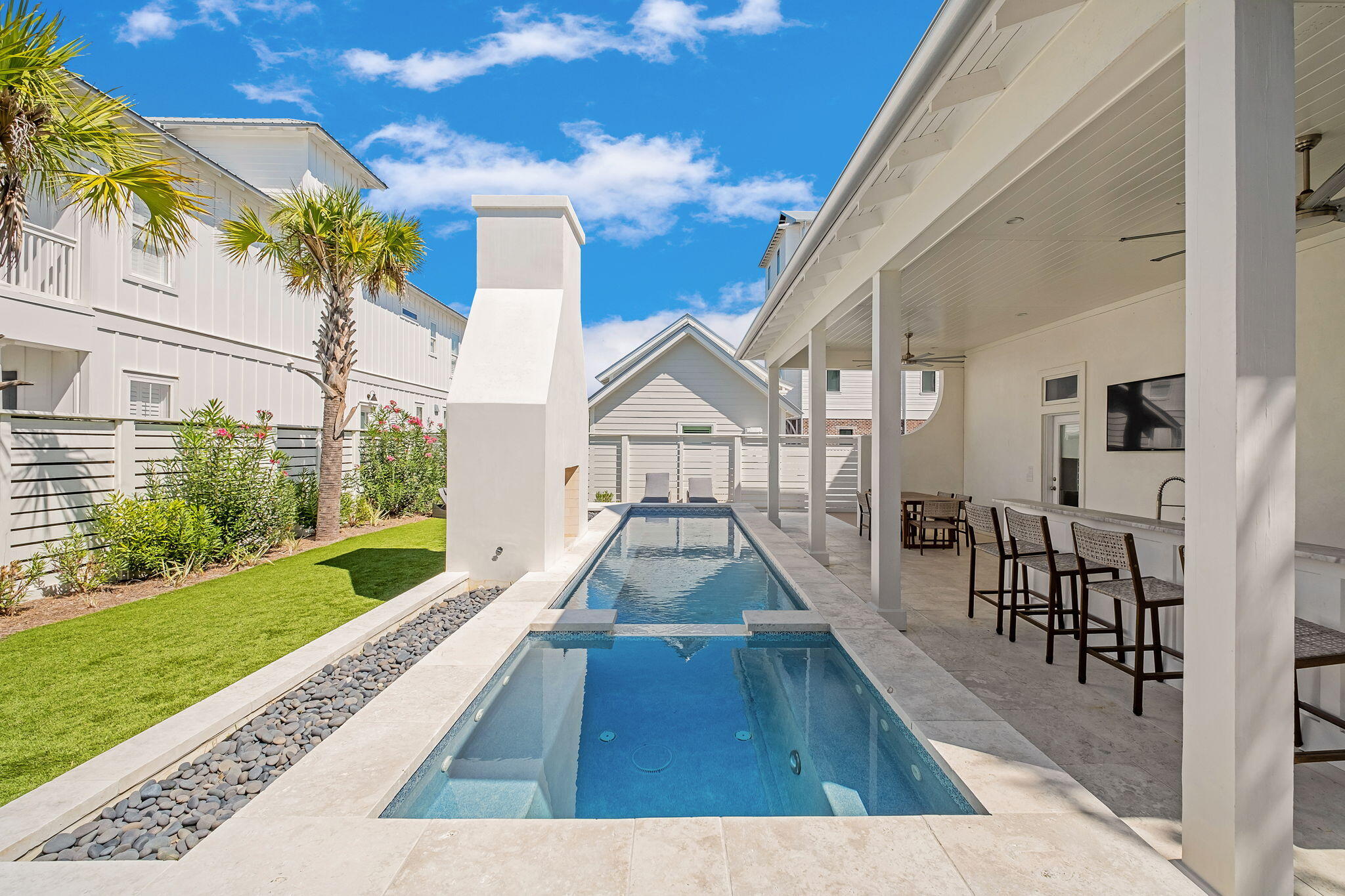 Gulf Views! Walk to Seaside! Positioned along Scenic Highway 30A with dedicated beach access directly across the street. This Gulf-view estate offers a refined balance of elevated design, privacy, and investment potential. Located just one mile from Seaside, the property sits within one of 30A's most coveted corridors, supported by strong and consistent rental demand, offered turnkey with bookings to transfer. Situated on an expansive corner lot, a pedestrian pathway leads across the street to a secluded boardwalk and private beach easement exclusive to Gulf Shore Manor, providing effortless access to the sugar-white sands and Emerald waters of the Gulf. The fully re-imagined backyard has been completely redesigned as an expansive, private outdoor retreat complete with a pool and spa, covered outdoor kitchen and bar, multiple spaces for dining and relaxation. 
This beach home is thoughtfully designed to accommodate large groups without sacrificing comfort or sophistication, featuring six bedrooms including custom built-in bunks and flexible sleeping arrangements ideal for both private use and short-term rental performance. Interiors reflect a curated blend of coastal feel and relaxed beach aesthetic, creating a timeless and inviting atmosphere. Projected annual rental income up to $226,000. Secure your next 30A investment with an established income producing rental that also feels like home.