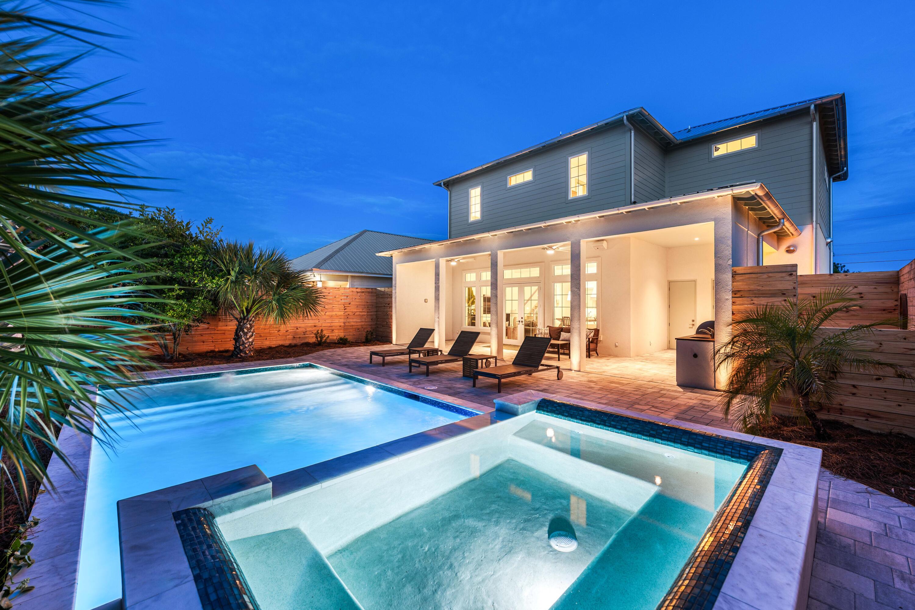 317 Le Grand Drive was built on a simple idea: a beach house shouldn't have to choose between effortless and exceptional.

Five bedrooms, four and a half baths, 2,572 square feet, sleeping up to 12 - this is a brand-new build designed around the way people actually want to spend a week at the beach. Mornings start on one of two covered balconies with Gulf views, close enough to the water to hear it roll in while the coffee's still hot, and the beach itself is a golf cart ride away, about a minute down the road, in a neighborhood built for exactly that pace. The rest of the day plays out around a heated saltwater pool and spa with a tanning ledge and custom seating, a summer kitchen and grill, and a patio wired for outdoor sound. A one-car garage plus five additional parking spaces means the whole group arrives - cars, golf cart, and all - without anyone circling the block.
Inside, the details do the talking. White oak floors run through the upstairs living spaces, the kitchen centers on a ten-foot quartzite island anchored by Fisher & Paykel professional-grade appliances, and the primary suite is finished in marble from floor to shower. An outdoor shower off the pool deck keeps sandy feet from ever making it past the door. Designer lighting and quality furnishings carry that same level of care into every room, and the home is sold fully furnished, right down to the tools in the garage - an owner or a guest can walk in and start enjoying it immediately, whether that's the first night of ownership or the first night of a rental booking.

What sets this house apart, though, is what a typical buyer never thinks to ask about until it's missing. The building envelope is fully sealed - hurricane-rated impact windows and doors, sealed sheathing and drainage layers built to shrug off salt air and storms, and a permanent termite pretreatment poured directly into the slab. Every interior wall carries sound-dampening insulation, so the house is as quiet inside as it is solid outside. For anyone who pays attention to what they're breathing, there's a dedicated fresh-air system pulling filtered outside air through the home around the clock, paired with a whole-house dehumidifier that keeps humidity and moisture in check year-round. That same forward-thinking carries into the everyday conveniences - whole-home WiFi and wired Cat6 connectivity, 24/7 security cameras with no subscription required, and power already run to the garage for an EV charger. This is a house built by someone thinking about year twenty, not just the open house.

Location is where this address really sets itself apart. Pier Park is fifteen minutes away, with its shopping, waterfront dining, Topgolf, and a Pirates Voyage dinner show that becomes the story of the trip. Ten minutes the other way down 30A leads to Rosemary Beach and its neighboring villages, known for boutiques, restaurants, and coastal design. Two of the Gulf Coast's best days out, both close enough to fit into an ordinary week here rather than a special occasion.

That combination - genuine walk-to-golf-cart beach access, a house engineered for air quality and built to outlast decades of coastal weather, and a location that pulls equally from Panama City Beach's biggest attractions and 30A's polish - is what elevates this property from a beach house into an asset built to perform for as long as you own it. 317 Le Grand Drive is the kind of new construction that gets better the longer you look at it, built to be lived in, rented, and enjoyed for decades to come. Schedule your private showing and see firsthand why this address sets the standard every other listing on this coast will be measured against.