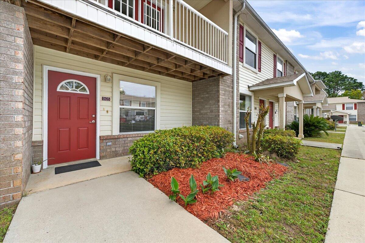 Freshly painted 2-bedroom, 2-bath townhome-style condo in a convenient location just minutes from the Mid-Bay Bridge, shopping, dining, and military bases. The main level features an open living area that flows easily into the kitchen, creating a comfortable space for everyday living or entertaining. A laundry area is located just off the kitchen for added convenience. Upstairs, you'll find two bedrooms and a full bath, including one bedroom with access to a private porch. With a functional layout and central location, this property offers a great opportunity for a primary residence, second home, or investment.