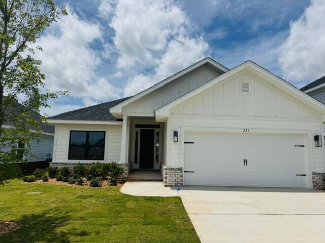 Just 20 minutes from the sugar-white sands of South Walton and scenic 30A, this sought-after Craftsman-style 4-bedroom, 2-bath home offers the perfect blend of coastal convenience and everyday comfort. Ideally positioned directly across from the community pool and cabana, the home is designed for easy living and entertaining. Upgraded luxury vinyl plank flooring flows throughout, while the main living area features a dramatic cathedral ceiling and 9'+ ceiling heights that create an open, airy feel. Eight-foot entry doors and quartz countertops add refined style throughout. The spacious owner's suite includes a generous walk-in closet, providing a peaceful private retreat. Furnished photos are of a similar home. Ask about 4.99% fixed interest rate and Move in Ready Package!