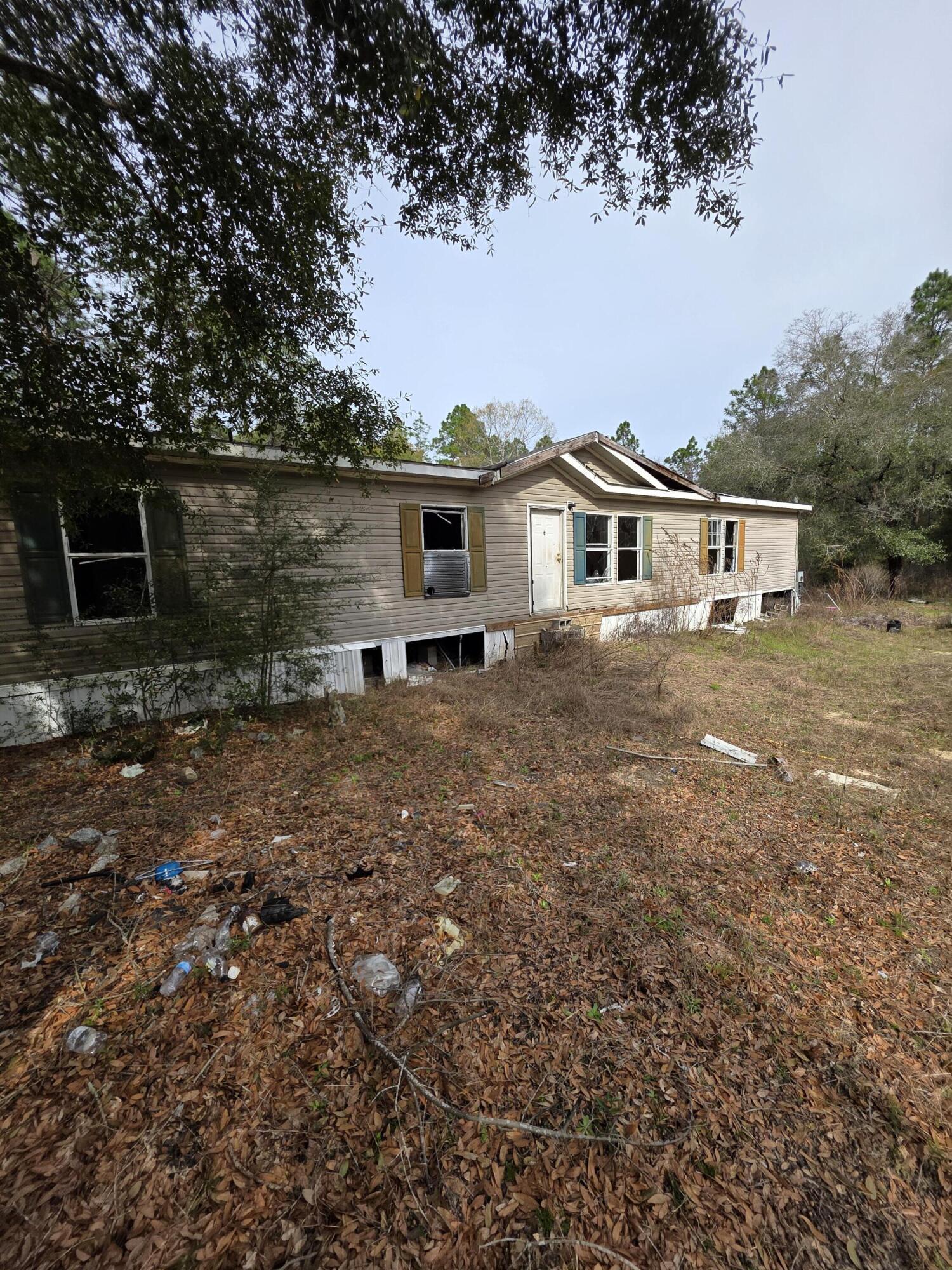 Excellent investment opportunity. 2009 Manufactured Home on 2 acres. Over 2100 sqft 5 bedroom 3 bath. Needs renovation but priced to give plenty of room. Peaceful and private location. Cash only.