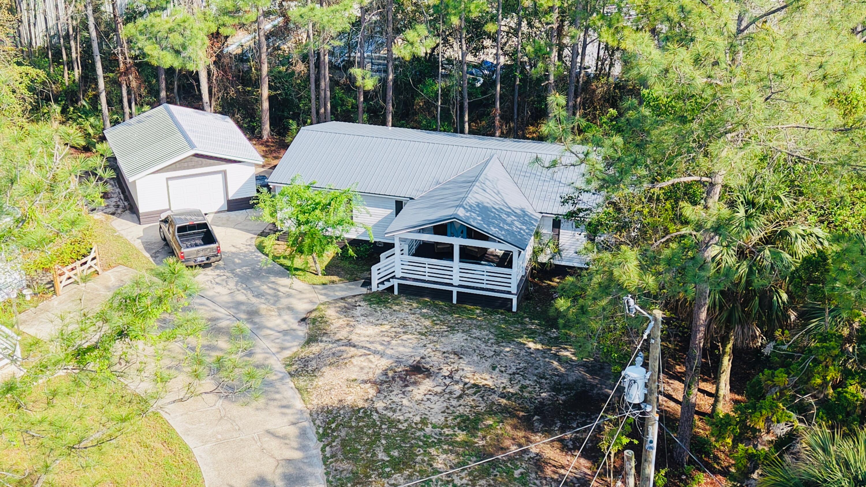 Immaculate, move-in ready home SOUTH of Highway 98 in Santa Rosa Beach! This beautifully updated 3-bedroom, 2-bath residence sits on a spacious 0.27-acre lot and is just one turn and approximately five minutes from the beach, offering the perfect blend of privacy and coastal convenience.

A charming covered front porch welcomes you. Ideal for enjoying your morning coffee or evening coastal breezes. Inside, you'll find an open-concept living and dining area filled with natural light, perfect for everyday living and entertaining. The updated kitchen features a modern farmhouse design with quartz countertops, stainless steel appliances, and ample workspace.

The bedrooms provide comfortable retreats, while both bathrooms have been stylishly renovated with thoughtful finishes. Additional highlights include a new garage, updated features throughout, and a large yard with plenty of room for outdoor living or future enhancements.

Ideally located near Scenic 30A, Grand Boulevard, Baytowne Wharf, shopping, dining, and entertainment, this home is perfectly suited as a primary residence, second home, or long-term investment.

Don't miss this rare opportunity to own a move-in ready home south of 98 in Santa Rosa Beach. Enjoy the beach and all the best of coastal living.