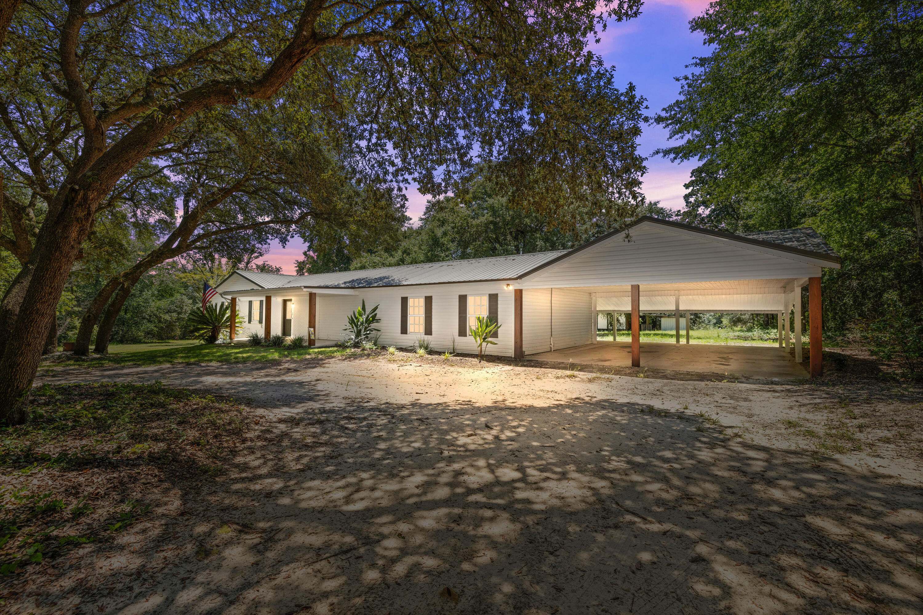 Charming farmhouse living on 4.05 acres! This 4BR/2BA home overs over 2,400 SF of space, including a sun-filled Florida room. Inside, the kitchen and baths have been tastefully updated while maintaining the warm country character that makes this home special.

Recent improvements provide peace of mind: HVAC, septic, water heater, and metal roof.

The acreage is full of possibilities-grapevines, walnut trees, and blueberry bushes already thrive here, while a mix of open land and shaded woods gives plenty of room to garden, raise animals, or simply relax. An outbuilding with covered space offers storage or hobby use and conveys as-is.