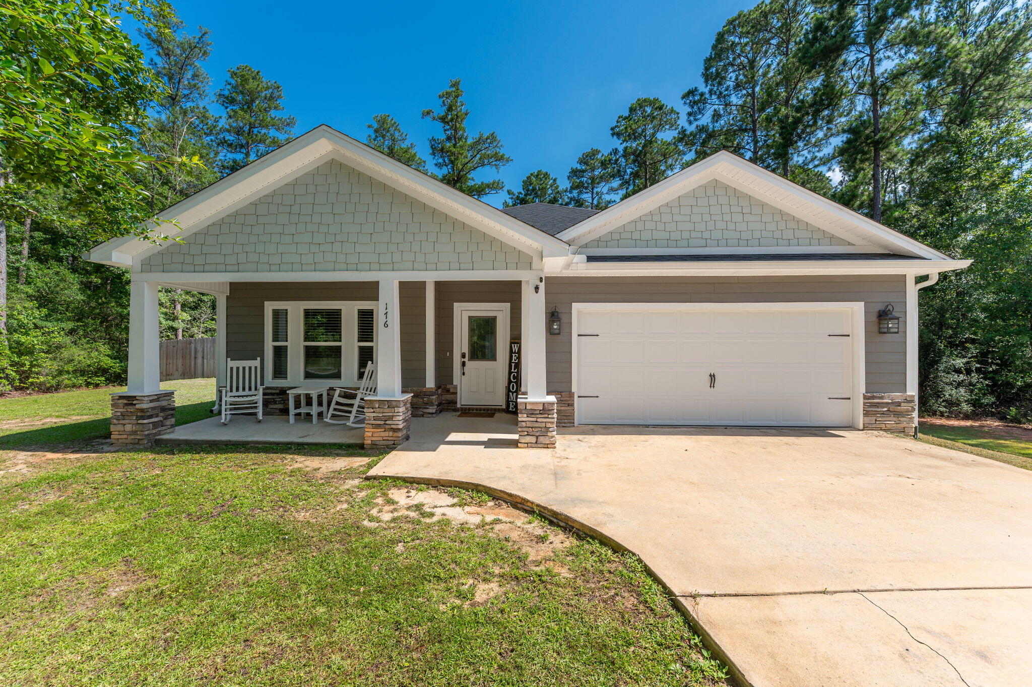 Beautiful 3-bedroom, 2-bath home situated on a full one-acre lot in the picturesque Indian Trails community. This charming home offers exceptional curb appeal with a welcoming front porch and an attractive exterior featuring Hardie board siding complemented by stone accents. Inside, you'll find a bright, open-concept floor plan designed for comfortable everyday living and entertaining. The spacious kitchen boasts abundant cabinetry, granite countertops, stainless steel appliances, a breakfast bar, and an adjoining dining area. The large living room provides plenty of space to relax and gather with family and friends. The private primary suite features a generous walk-in closet, dual vanities, a garden tub, and a separate shower. Two additional guest bedrooms are well-sized and share a full bathroom. Additional highlights include a two-car garage, a large fenced section of the backyard that's perfect for pets or play, and an expansive wooden deck ideal for outdoor entertaining. Enjoy the privacy and tranquility of country-style living while still being conveniently located to nearby amenities. Owners will have full use of Indian Trail's amenities, including Arrow Lake (10 acres), Tilley's Lake (4 acres) and a 2-acre park with picnic tables and barbecue stands. Buyer to verify all information.