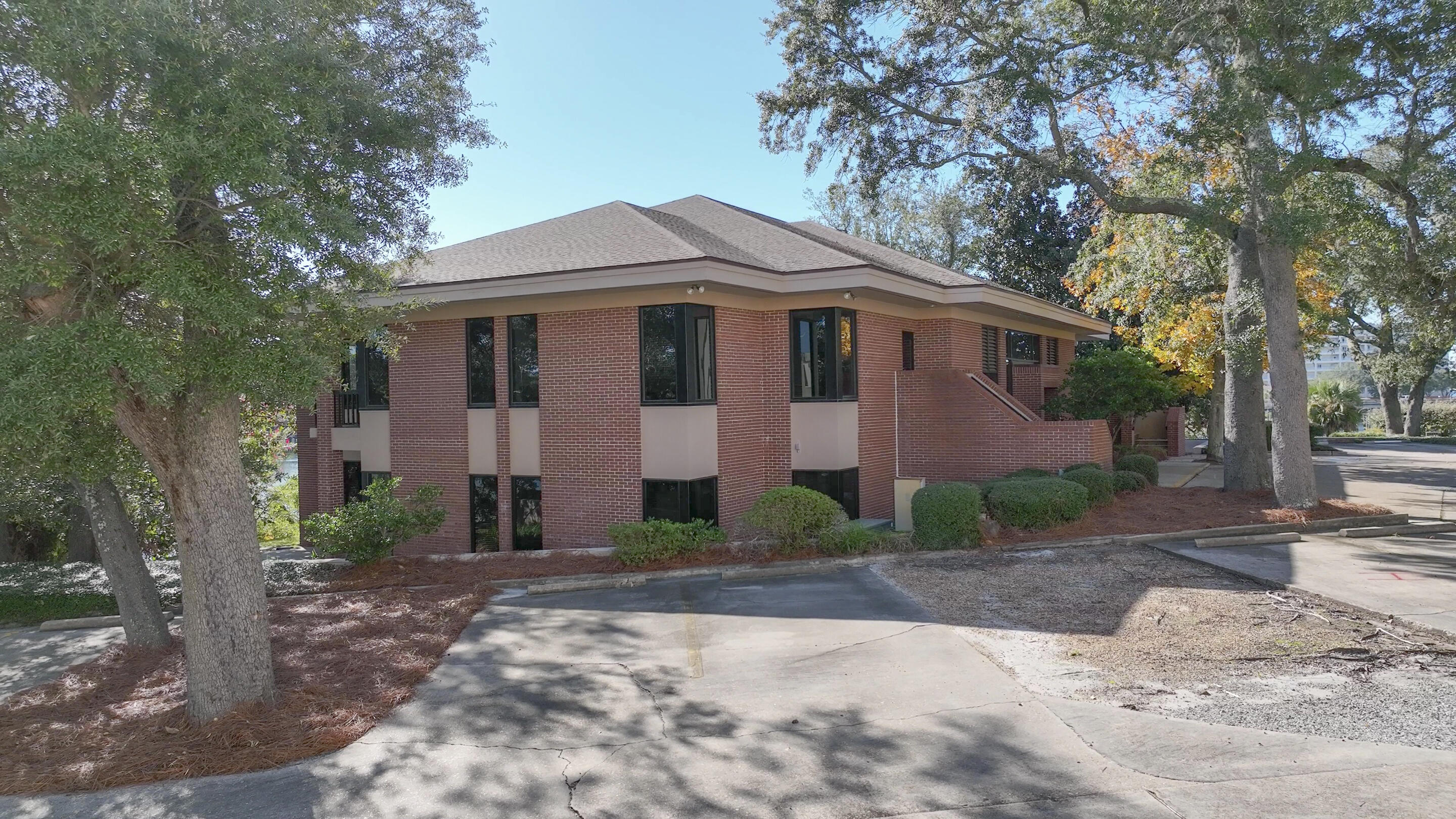 The Barron & Redding Law Office is available for sale. One of the most prestigious Class ''A'' law office buildings in Panama City. Located adjacent to the Bay County Courthouse on Massalina Bayou which leads directly to St. Andrew Bay and the Gulf of America. The 10,157 square foot, two-story office building is situated on 1.1 acres. Masonry construction with brick veneer and huge windows throughout. The entire office has extensive wood moldings, paneling, and trim, particularly in the attorney's offices, conference rooms, and law library. The two-story office includes 18 large private offices, 2 conference rooms, a law library, open office for paralegals and administration, workspace, large breakroom, and reception. Built in 1986 and renovated in 2019 following Hurricane Michael. The well-constructed building received minor damage from the Hurricane. The following renovations were completed: all new storm-rated impact windows and doors, new roof, new HVAC systems, and new flooring. There is +/-550 linear waterfront feet on Massalina Bayou with a submerged land lease in-place that provides for the deep-water dock space with a large pier and wooden dock capable of accommodating several large boats. Gorgeous views across Massalina Bayou. The Bay County Courthouse is less than 300' up McKenzie Avenue. Beautiful landscaping with mature oak trees all over the property. The location cannot be matched, and they truly do not make them like this anymore. The site plan, elevations, and floor plans are attached. Call for further details and to schedule a tour. Barron & Redding is merging with Hand Arendall.