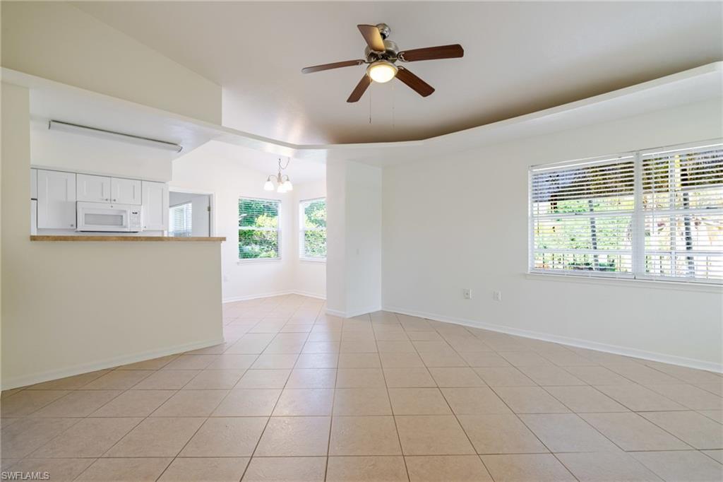 Beautiful, bright corner-unit 2-bedroom, 2-bath condominium in the highly desirable Venetian Palms community. This second-floor residence features extra windows, abundant natural light, and beautiful panoramic views. Enjoy your morning coffee or evening sunsets from the screened lanai overlooking the peaceful surroundings. The unit also includes one assigned covered carport parking space. Residents enjoy resort-style amenities, including two swimming pools, a fitness center, tennis courts, racquetball, volleyball, a library, and a beautifully appointed clubhouse. Conveniently located near shopping, restaurants, medical facilities, beaches, and Southwest Florida International Airport (RSW).
