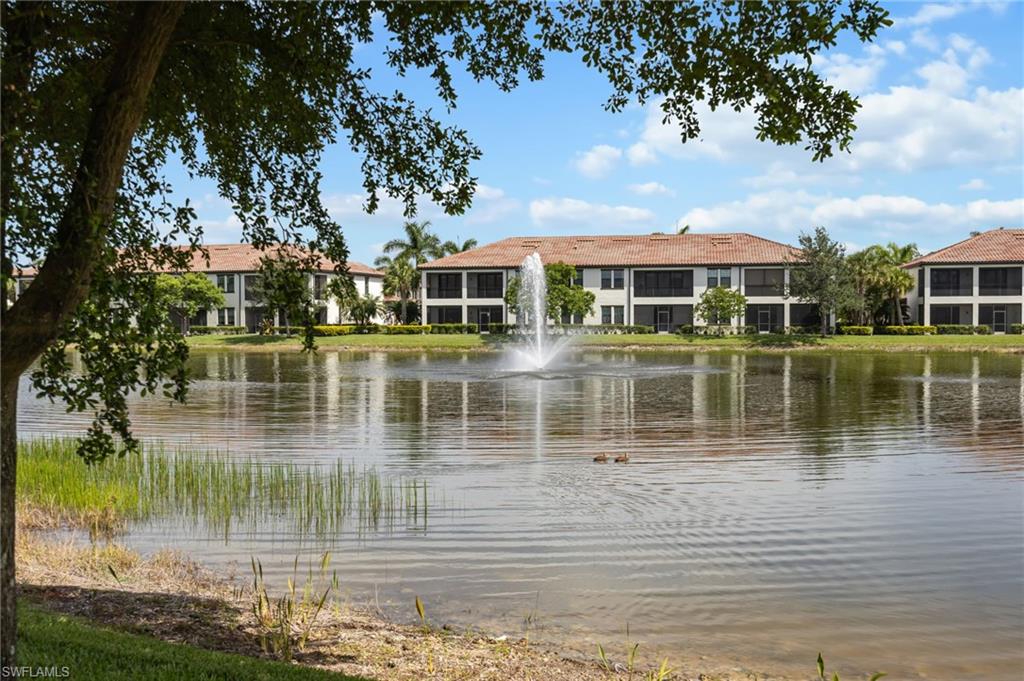 Experience elevated living in North Naples! Step into a lifestyle of comfort and convenience with this captivating first floor condominium offering a stunning view of Palmer Lake. Boasting 2 bedrooms (both with sizeable walk-in closets) and 2 bathrooms. Tile and LVP flooring throughout - no carpet! Plantation shutters on all windows. Plenty of separation between the master suite and guest bedroom. The master suite offers a large bedroom, ensuite bath including floor-to-ceiling tiled shower with frameless doors, and a generously sized walk-in closet. Kitchen offers rich wood cabinets, granite countertops, and modern stainless steel appliances all flowing seamlessly into the great room and dining area making it perfect for entertaining or simply relaxing. The entire area is bathed in natural light, with sliding glass doors opening to your private lanai overlooking a peaceful fountain on Palmer Lake.  You'll appreciate the added benefits of impact windows and doors throughout the home and a location not in a flood zone. Nestled in the heart of North Naples, Livingston Lakes is a pet-friendly, gated community. With just 230 homes, this charming neighborhood boasts resort-style amenities, including a sparkling pool with lap lanes and cabanas, two built-in gas grills, a stylish clubhouse with a catering kitchen and library, a state-of-the-art fitness center, and a cozy outdoor fireplace and fountain—all with remarkably low fees. Next door to North Collier Regional Park, where miles of scenic nature trails, top-tier sports facilities, a water park, and the Golisano Children's Museum await. Plus, you’re less than five miles from the breathtaking white-sand beaches of the Gulf of Mexico. With endless shopping and dining options in every direction and convenient access to I-75 and multiple international airports, Livingston Lakes is the perfect place to call home.
