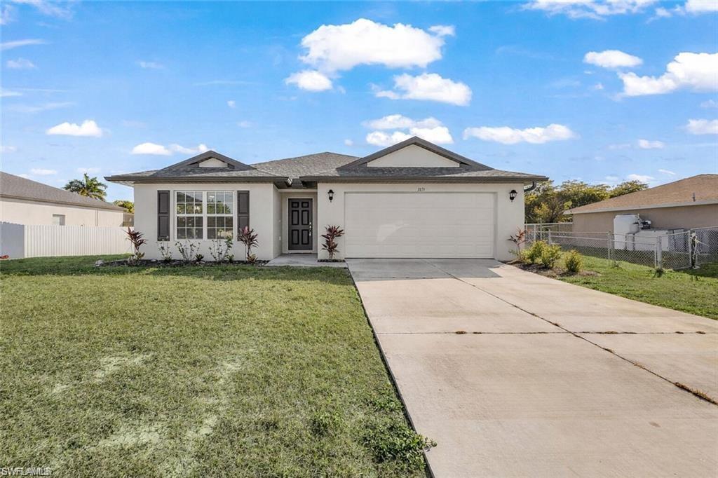 SHORT SALE!! Furnished and move-in ready! This barely lived in, only used for family, like brand new 2023-built single-family home showcases a modern coastal design with an open floor plan, offering 3 bedrooms, 2 bathrooms, and 1,551 square feet of thoughtfully designed living space on a quarter-acre lot in a Flood Zone X area (no mandatory flood insurance) and a 2-car garage. The home is being sold fully furnished, including all furniture and décor styled in a modern coastal aesthetic, making it an ideal option for buyers seeking a seamless transition. The open-concept layout creates a bright, inviting atmosphere for everyday living and entertaining, complemented by stainless steel Whirlpool appliances and contemporary finishes throughout. Enjoy Florida living year-round in the screened-in lanai, enhanced with a newly added screen enclosure, and a fully fenced backyard offering privacy and space to relax or entertain. The oversized backyard provides ample room for a future pool, allowing buyers to further customize the outdoor space to their liking. The epoxy-coated 2-car garage floor adds a clean, finished look, while the new washer and dryer provide added convenience. The septic system and A/C were professionally serviced in 2025, offering added peace of mind. The property experienced no damage from prior hurricanes, including Hurricane Ian, providing additional reassurance. Located in a quiet neighborhood with great neighbors, this home offers a peaceful setting while remaining close to everyday conveniences. With its turnkey condition, modern finishes, and flexible layout, this home is perfectly set up for use as an Airbnb or short-term rental, subject to local regulations. Additional highlights include newer construction, a well-maintained interior, and a prime location within approximately 15 minutes of downtown Cape Coral and downtown Fort Myers, providing easy access to dining, shopping, entertainment, and waterfront attractions. This is a rare opportunity to own a turnkey, barely lived in, like-new modern coastal home with a 2-car garage in Cape Coral—everything is included. Simply bring your personal belongings and enjoy!