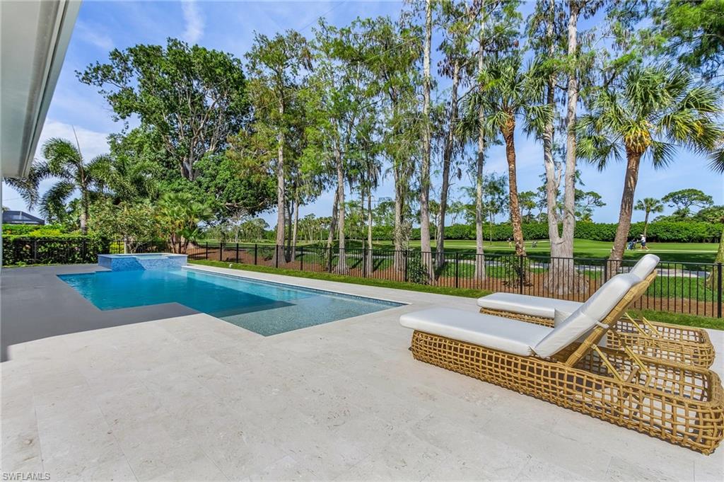 Introducing 130 Burning Tree Drive - a newly completed and fully furnished home built by Borelli Construction, Naples' premier luxury builder with decades of experience. The home has stunning wide views of the completely renovated Country Club of Naples golf course. Inside you'll find the high end finishes you expect from Borelli Construction including custom closets, extensive trim work, detailed ceilings, French white oak wood flooring throughout, SubZero and Wolf appliances, natural stone counters in the bathrooms, Andersen impact windows and more. The home gets stunning natural light beginning in the study off the foyer. The primary suite is privately tucked away on one side and features a spacious bedroom with sliders to the covered lanai, two closets, and tranquil bathroom. The two guest bedrooms are generously sized with walk in closets and en-suite bathrooms. The kitchen includes plenty of solid-wood cabinetry for storage, a wet bar with SubZero beverage fridge, and a separate pantry. The family room and dining space are all conveniently located with the kitchen in the open great room with views of the pool and golf course. The covered lanai is equipped with a full outdoor kitchen and space for entertaining. Beyond the lanai is the heated salt-water pool and spa with sun-shelf and fire pit on the pool deck. Burning Tree Drive is located in the heart of Naples with quick access to any part of town and all the best shopping and dining.