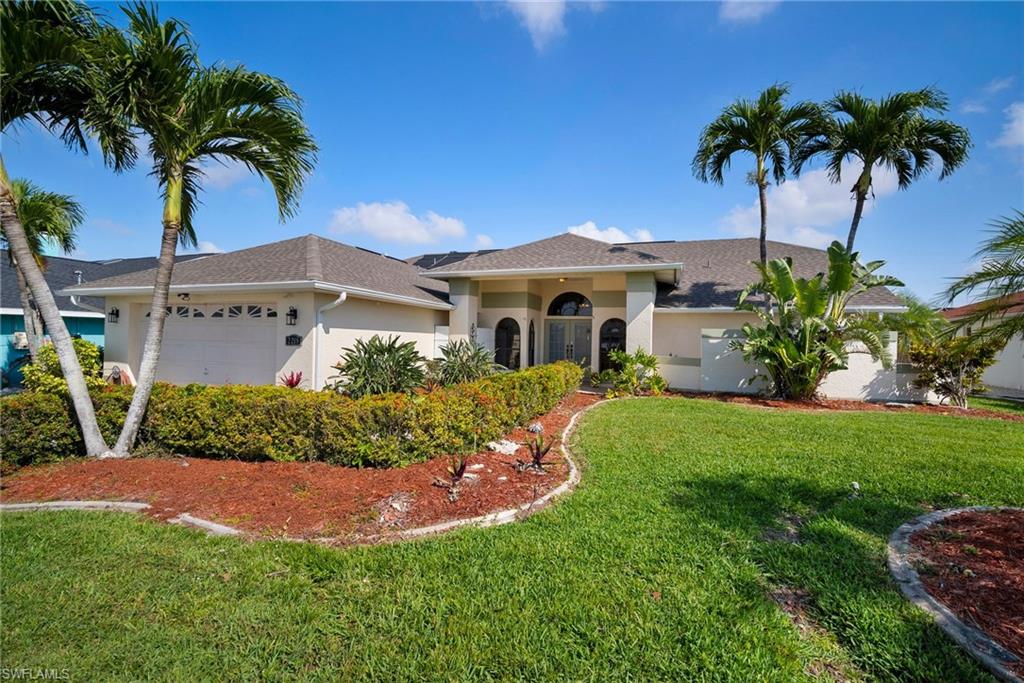 Opportunity is knocking!!!! This stunning turnkey home is perfect for anyone looking for direct Gulf-access and a total remodel. Featuring 3 bedrooms, 2 and a half bathrooms, and a 2-car garage home it is complete with a pool and spa and an 80' dock. The tile floors provide easy maintenance and the vaulted ceilings and crown molding give it a sophisticated touch. The large windows and sliders bring in plenty of natural light to create a bright and sunny atmosphere. All windows are wood-cased and the home has upgraded lighting, fans, and window treatments. The chef's kitchen is complete with all wood 42" upper cabinets, new stainless steel appliances, plenty of counter space with level 5 granite tops, and a center island eat-at-bar. The master bath features very nice tiled  walls, his/hers closets, a large multi head shower with steam generator, and a jacuzzi tub. . The large custom pool and spa with its stamped pool deck and covered lanai space are perfect for entertaining. The 80' dock has a deep-water with 5' draft, 60 amp, 220 volt, and water, and can accommodate up to a 60" yacht.