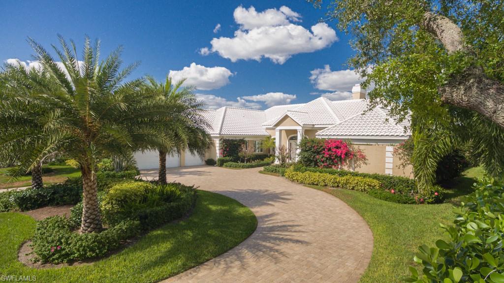 Significant price improvement makes this Pelican Bay property THE MOST DESIRABLE PURCHASE.  The most desirable community - Pelican Bay - with its stately homes and Naples only private beach.  The most desirable property in the most desirable area - Barrington of Pelican Bay.  The most desirable lot - with stunning, long, lake views.  The most desirable property - year-long outdoor living with an expansive screened covered lanai with an open-air pool and hot tub.  A formal dining room and a formal living room - French doors open to the lanai for indoor/outdoor entertaining.  Large kitchen opening into the family room with an abundance of natural light and fabulous lake views. All bedrooms are ensuite bathrooms; two additional half baths, a powder room and a pool bath.  Great oversized master bedroom, office/den adjacent to the master (with a fireplace that also opens to the living room), two walk-in closets, double sinks, custom shower and separate tub. Pelican Bay offers three miles of private beach and two beach restaurants, a community center with a full fitness center and spa and two tennis centers.  Electric hurricane shutters in the lanai; impact windows.  No H Ian damage.
