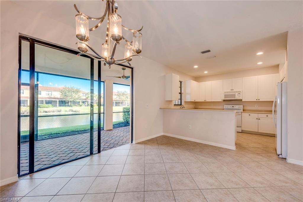 Ready for it's new owners! Carpets cleaned, minor repairs done and move in ready! This 3 bedroom, 2.5 bath, two story townhouse has an ATTACHED garage and a large lanai overlooking the lake. Enjoy grilling out and relaxing while you take in the wonderful view of the lake and enjoy the tranquil sound of the fountain. The kitchen has a wrap around bar adjacent to the dining area, making it a great space to host family and friends! The 3 bedrooms are all tucked away upstairs allowing for quite time. The master bedroom suite has it's own bathroom with a separate tub, shower, and a walk in closet! Located in Bristol Pines, this neighborhood offers a resort-style pool, gym, basketball court, tennis court, and even a soccer field! One of the fastest growing areas of North Naples. Schedule a private showing today!