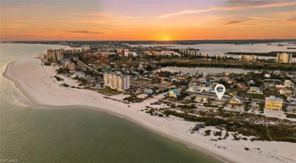 Presenting the crown jewel of fort Myers beach. Direct Gulf-front vacant lot on Fort Myers Beach, build your beachfront legacy. 8010 Estero is an extraordinary piece of land. With FULL panoramic views of the glistening white sand beaches, the sparkling teal water of the Gulf and the daily golden hours of a west side sunset truly pure natural theatre when the sky lights up into infinite fiery orange, pink, blue, red and lavender colors it is a spectacle to behold. An oversized beach front lot ready to be built on. Opportunities like this come far and few in between. WEEKLY RENTALS ALLOWED. The size of this lot is knocking on almost a half acre. Plenty of room for your custom beachfront pool home. Located centrally  between Fort Myers Beach and Bonita beach you have plenty of options for entertainment, dining, sports, socializing, endless strolls on the beach and enjoying that SWFL sun. Your time to buy this one of a kind property is now with this once in a lifetime opportunity.