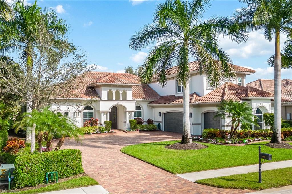 Stunning custom estate in the desirable Classics neighborhood in award-winning Lely Resort. This remarkable quality-built and immaculately maintained residence features four bedrooms plus study and recreation room, five baths, three-car garage and breathtaking golf views. Upon entering the dramatic front doors, you’re welcomed by impressive 14-foot tray and coffered ceilings with crown molding and indirect lighting, plantation shutters, floor-to-ceiling sliders and wood-like tile flooring. The gourmet kitchen is equipped with gas cooking, Viking appliances, premium cabinets with pull-outs and soft-close, and granite countertops. The impressive outdoors features a heated lagoon-style pool with spa in a picture-window screen enclosure offering extraordinary views, enhanced by a gas fireplace and outdoor kitchen. Upstairs is a versatile bonus room complete with kitchenette and bath. Other features include impact glass, custom closets, built-ins, wine chiller, Sonos, new 24-kilowatt home generator, electric shades, security, central vacuum, ample storage, and a three-car garage with epoxy floor and built-ins. Amenities include dining, golf, gym, tennis, pickleball, bocce and dog park.