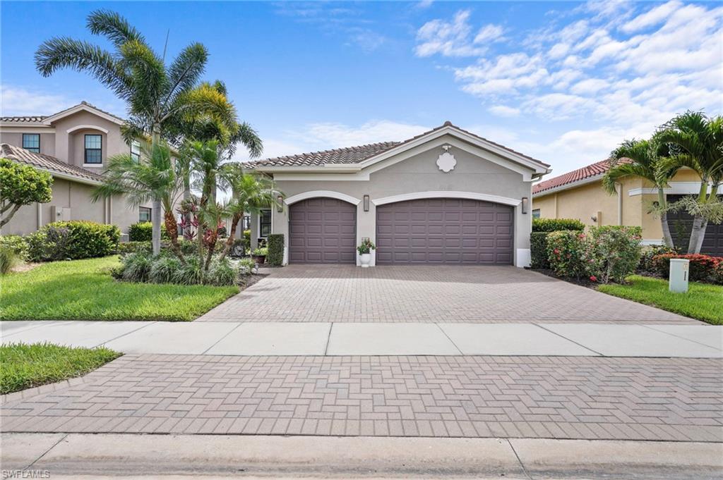 SELLER IS ACCEPTING BACKUP OFFERS**********Welcome to Marina Bay and the home you’ve been dreaming of. From the moment you walk in this beautiful lakefront home, you will be amazed by the exceptional custom upgrades and details throughout.  This beautifully appointed 3-bedroom + den, 3-bath lakefront residence features a 3-car garage, low HOA fees, and exceptional upgrades. Elegant Italian flooring flows through the main living areas, while the bedrooms showcase custom-finished hardwood floors. The home is fully protected with storm-impact windows and sliders, plus electric Kevlar screens spanning the entire rear lanai.  Designed with both luxury and comfort in mind, the home offers soaring 12-ft ceilings, double crown molding, and dramatic tray ceilings in the foyer, living room and primary bedroom also medallion accented lighting throughout. Extensive windows and sliding glass doors fill the interior with natural light, creating a bright and airy ambiance throughout home.  The spacious primary suite features a tray ceiling with crown molding, dual walk-in closets, marble-topped vanities, a soaking tub, and a walk-in glass shower accented with floor-to-ceiling tile.  The chef’s kitchen is equipped with 42-inch upper wood cabinetry, stainless steel appliances including a new dishwasher-2024 and refrigerator-2024, Silestone by Cosentine countertops and reverse osmosis water filtration in the kitchen and whole house water softener both-2025. Additional updates include a new A/C system in 2024 and water heater-2022 .  Step out to the rear lanai and enjoy an open patio finished with paver stone decking and travertine tile. A custom illuminated waterfall creates the perfect backdrop for relaxing evenings and serene lakefront morning sunrises.  Residents enjoy outstanding resort-style amenities, including a clubhouse, resort-style salt-water pool & lap pool, indoor & outdoor basketball courts, fitness center, pickleball and tennis courts, and children's splash pool and outdoor playground (yet pay low HOA dues).  This is a must-see home you don’t want to miss!