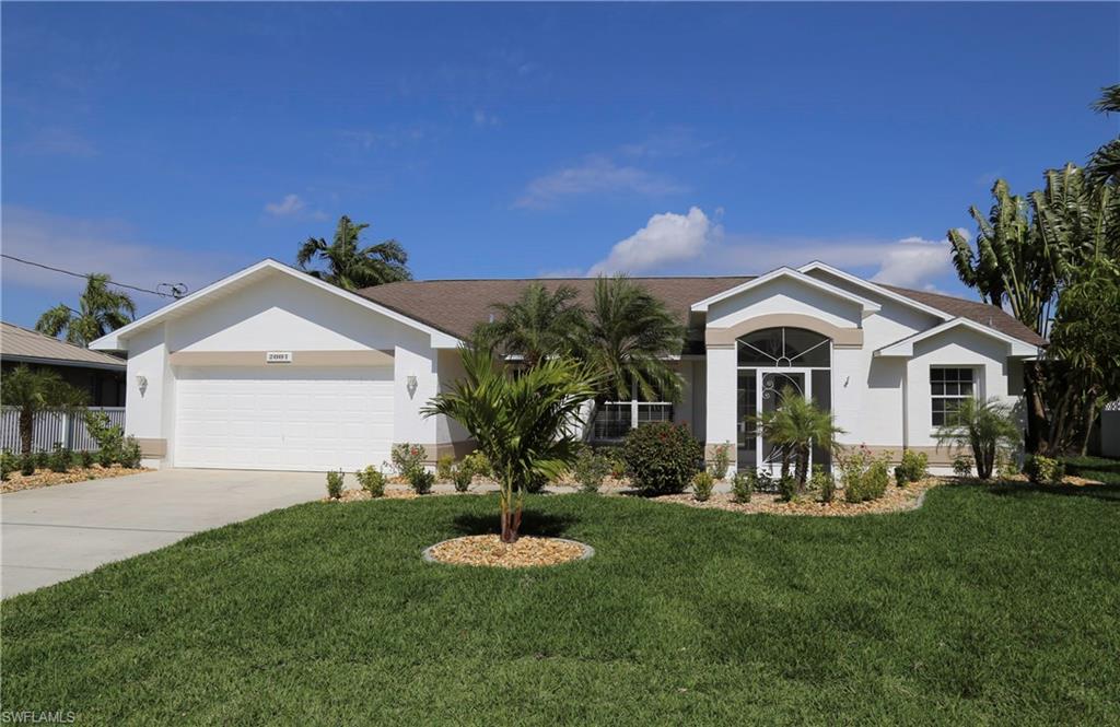 Picture perfect direct access pool home ready for immediate occupancy! Beautiful double door entry opens to bright great room w/cathedral ceilings & immediate views of canal & pool.  Wonderful kitchen w/granite counters, nice cabinetry,  brand new stainless steel appliances, large pantry, & breakfast bar.  Dining options include formal dining as well as casual breakfast room- great views to enjoy your morning coffee!  Extra large master bedroom w/cathedral ceiling, crown molding, sitting area & add'l closet space! Master bathroom has soaking tub, tiled shower and two walk in closets with California shelving. Split bedrooms offers privacy and pool bath offers added convenience. Large screened lanai with accordion shutters, nice area under truss for shade & plenty of room for sunbathing. Boat lift w/wraparound wooden dock! Other great aspects -inside laundry room w/laundry sink, Manabloc plumbing, storm shutter panels & pull down stairs to attic. Interior & exterior just painted, new landscape - brand new hot water heater, AC replaced 2013! Quick direct access to Caloosahatchee River -nice neighborhood & convenient location! City water & sewer in & paid!  Home is ready to move into!