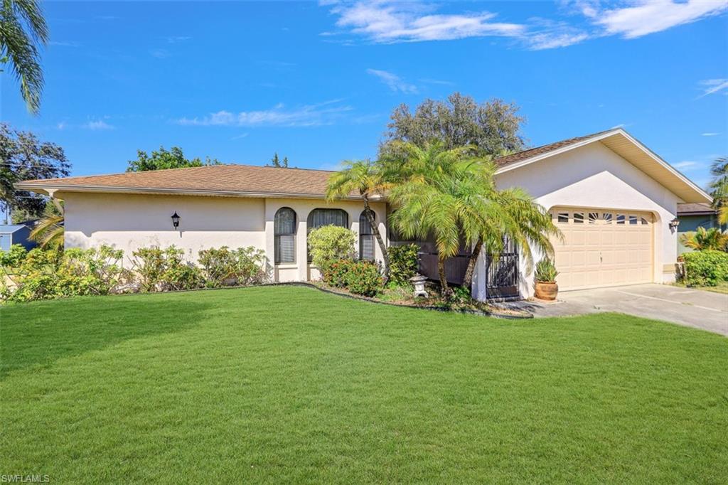 Great SE Cape Coral Location....water & sewer are in...3 Bed 2 Bath 2 Car Garage split floor plan with cathedral ceilings, screened lanai & large yard, perfect for installing a pool. Needs some updating but is a well cared for home with CBS construction. Nestled in a neighborhood off Santa Barbara places you close to everything....family fun activities such as Sun Splash, parks + shopping, restaurants & more. All that's missing is you!!