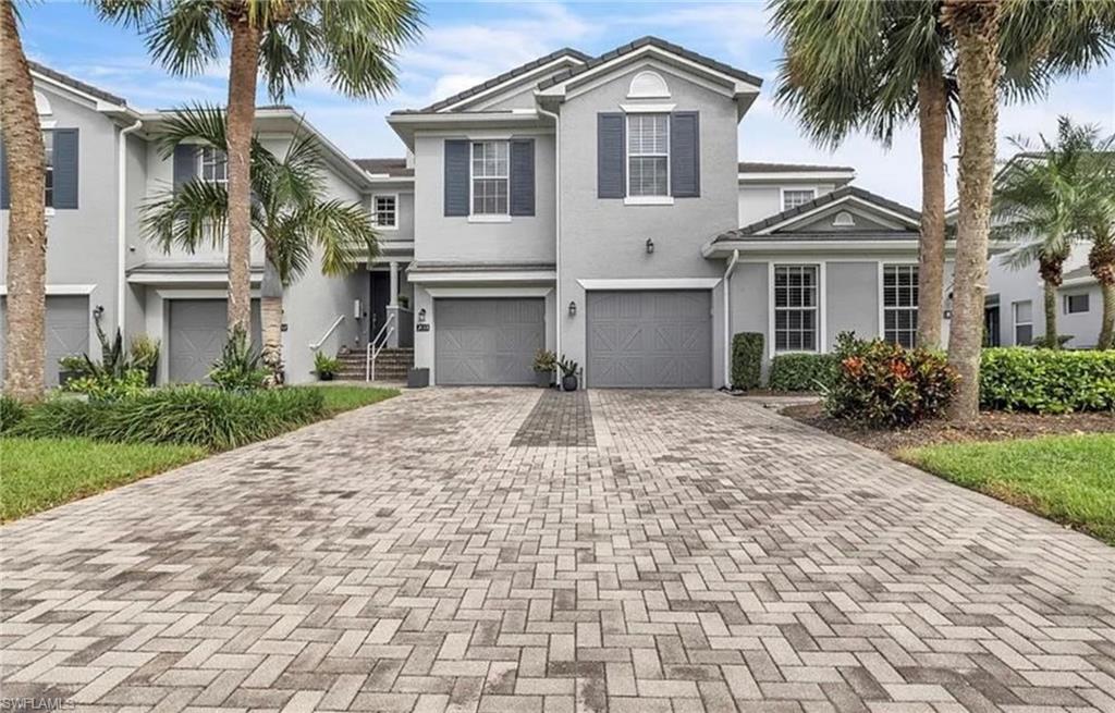 Short Sale Alert! This is your chance to grab this large upper condo with ALL TILE in beautiful River Hall Country Club! Over 2100 sq ft for this price is unheard of in Lee County! Bundled golf membership included and your condo fees pay Internet, Water, Sewer, Trash and Cable! Just pay electric and your golf dues and start living the Southwest Florida lifestyle! First floor entry with attached garage makes this coach home feel like a large townhouse, complete with a motorized chair lift! Vaulted ceilings, a large screened-in lanai featuring remote Storm Smart hurricane screens with serene views for enjoying your morning coffee or dinner with friends and a split bedroom floor plan give you the privacy you seek with guests or family in town. Have you seen the oversized master bathroom with soaking tub and separate shower?! This place is huge!! And did we mention this property is sold 100% TURNKEY! Beautiful modern style furnishings, leather sofa in den, multiple TVs and so much more! Just bring your clothes, buy a golf cart and play unlimited golf year-round! Large eat-in kitchen with newer stainless steel appliances, subway style black splash and newer granite counter tops. Ashton Oaks is the ONLY section of River Hall with a hot tub in the entire community! River Hall has a private, members only 'bunker bar' restaurant featuring live music and happy hour weekly at the heated pool! Caloosa grill inside the clubhouse for after golf lunch or fine dining, 2 driving ranges with unlimited balls, 2 putting greens, a 3-Hole 'Short Course', fully stocked pro-shop, golf clinics, private lessons, and an 18-hole Davis Love III designed course that allows you to walk 7 days week for free! in front of the guard house, you will see the River Hall Town Center. There you will find a large, second floor gym with Yoga room, another massive resort pool, activity room, library, billiards table, ping pong table, lighted pickleball and tennis, lighted bocce courts, and a basketball area! You will not find a better deal in all of SW FL!