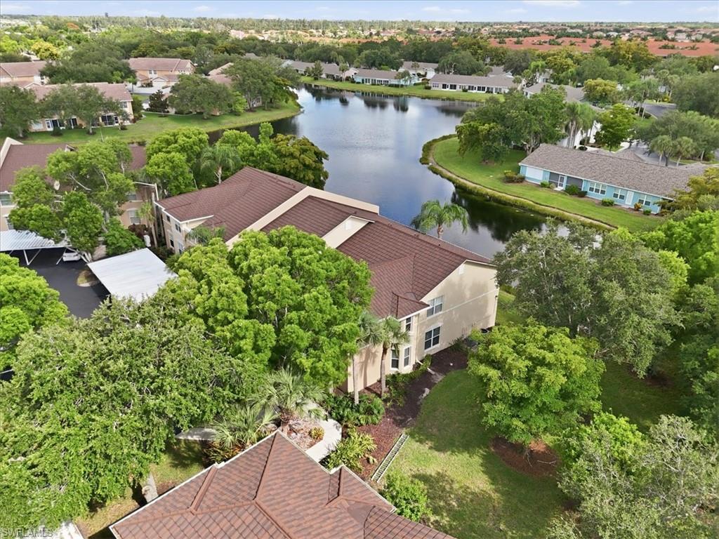 One or more photo(s) has been virtually staged, AI generated or rendered.  Experience peaceful lakefront living in this stunning, top-floor 2BR+Den/2BA condo located in the highly desirable gated community of Bridgeway at Parker Lakes. This meticulously upgraded residence features soaring vaulted ceilings that create a bright, open, and airy ambiance. The chef’s kitchen is fully modernized with premium quartz countertops, top-tier stainless steel appliances, and custom soft-close cabinetry complete with a built-in lazy Susan and spice rack. Luxury vinyl plank flooring (2025) flows seamlessly throughout. NO CARPETING. The primary suite offers direct lake views, lanai access, a walk-in closet, and a spa-like en-suite with a dual-sink quartz vanity. The guest bathroom is equally upgraded with designer finishes. Major high-ticket updates provide ultimate peace of mind: a brand-new roof (2025), new A/C (2024), recent washer/dryer (2023/2025), a detached carport with a metal roof (2023), and a preferred non-flood zone designation. Relax on your south-facing screened lanai to enjoy glowing evening sunsets. Parker Lakes offers resort-style amenities including a lagoon pool, lap pool, spa, tennis, pickleball, fitness center, and walking trails. Pet-friendly up to 35 lbs! One or more photo(s) has been virtually staged, AI generated or rendered.
