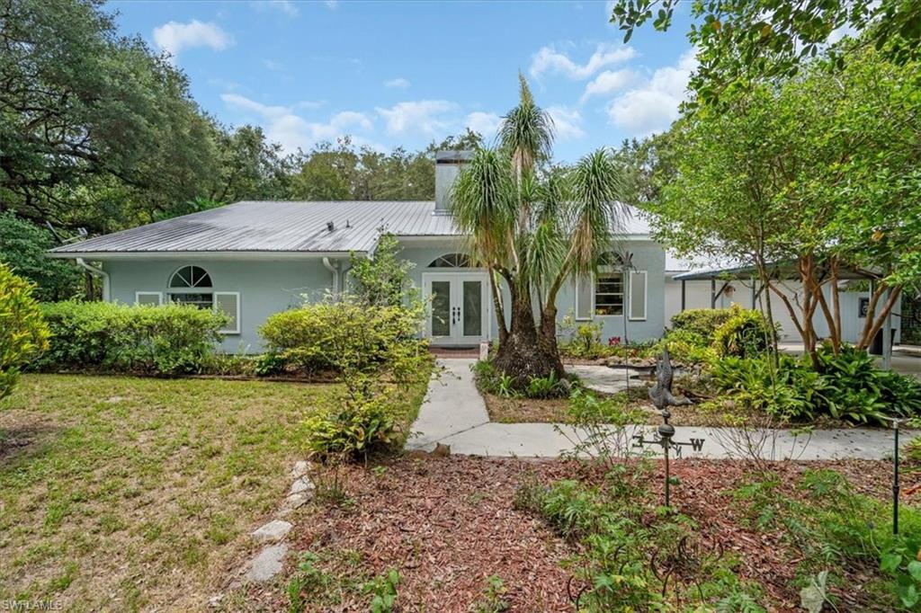 Discover the peaceful oasis in desirable Felda, FL!  This CBS home was custom built in 1987 and offers a rare opportunity to own 6.71 acres of secluded, lush landscape brimming with native flora and fauna.  Spanning over 1800 sq ft of living space you're sure to enjoy the double door entry into an inviting foyer, to an open Great-room design.  The vaulted ceilings, custom windows, wood burning fireplace with formal dining are all a bonus.  The oversized master suite is complete with a private screened porch, walk-in closet, dual sinks and private water closet.  Many original features include, an oversize kitchen, with built in desk, ample cabinet space, double pantry and interior laundry closet.  The attached garage includes a half bath, with bonus room ready for your personal upgrades. Designed for privacy, this property features a durable galvalume roof, a paved circle drive, sprawling porches & patios perfect for entertaining or enjoying your private pond and stunning gardens.   Exterior amenities include a detached double carport, fully equipped workshop, potential "she-shed," animal shelters and storage shed.  This home is mostly original and provides the perfect pallet for all your future upgrades.  No Flood Zone per FEMA Flood Maps and No HOA.  Make an appointment today for your private showing!