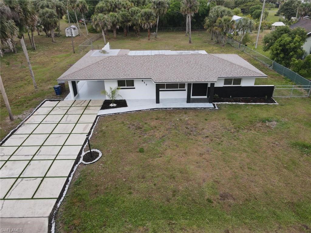 Welcome to this fully remodeled residence in the heart of Central Lehigh Acres, where modern design, freedom of use, and expansive land come together in one exceptional offering. Situated on a rare 0.5-acre fully fenced homesite, this property delivers the space, privacy, and flexibility that are increasingly hard to find in today’s market.

With **no HOA and no restrictions**, you have the freedom to truly make this property your own. Whether you envision expanding the home, adding a detached garage, building an efficiency unit, or creating a private outdoor oasis with a pool, the possibilities are wide open.

Inside, the home features 3 bedrooms, 2 bathrooms, and a versatile den that can serve as a fourth bedroom, office, or additional living space. The interior has been thoughtfully upgraded with a modern kitchen showcasing white cabinetry, a spacious island, stainless steel appliances, recessed lighting, and all-new fixtures throughout. The home is also fully connected to city water with updated plumbing, providing added peace of mind.

The bathrooms have been beautifully refreshed with new vanities and a luxury-style rain shower system, offering a clean, contemporary finish.

What truly sets this property apart is the land itself. The expansive half-acre lot provides a rare sense of space and opportunity, fully fenced for privacy and security, with ample room for future additions, recreational use, or income-producing structures such as an efficiency unit or guest quarters. This is not just a home, it is a long-term investment platform with strong upside potential.

Located close to shopping, schools, dining, and major commuter routes, this property offers both convenience and long-term growth in one of Southwest Florida’s fastest-developing areas.

A remodeled home with acreage, freedom, and income potential like this will soon be found by the perfect buyer.