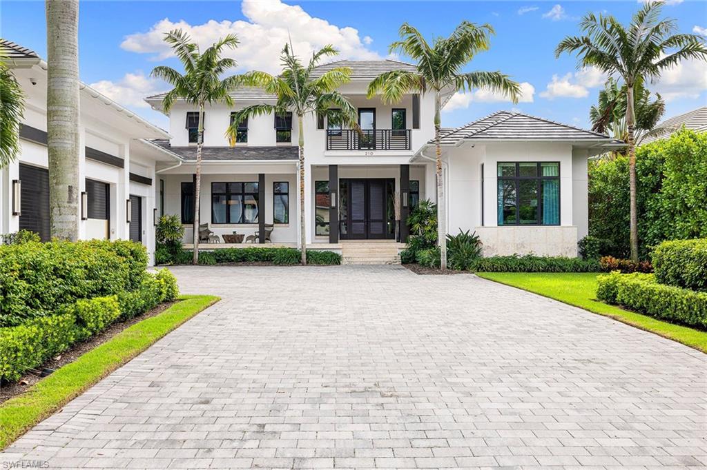 This impeccable, private residence is near the beach on North Lake Drive. Designed by Falconer Jones III and executed by BBa Development, the residence features custom interior design and finishes by Lisa Ficarra. The six-bedroom, nine-bath home boasts 8,093 square feet and sits lakeside on an oversized lot with .52 acres. Thoughtful design features include Ludowici clay tile roof, Legno Bastone wide-plank flooring, gourmet kitchen with butler’s pantry and outdoor coral stone throughout the property. An expansive outdoor entertaining space flows into an inviting pool and spa area, overlooking the picturesque lake and lush landscaping. The property is conveniently just minutes from the highly anticipated new Four Seasons Beach Club, and shops and dining on Fifth Avenue and 3rd Street.