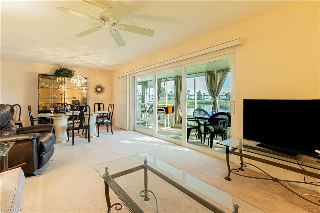 This bright and spacious 2 bedroom/ 2 full bath turnkey furnished 1st floor condo is calling your name.  Features include impact resistant windows and sliders, Split floor plan with generous Master bedroom, updated Full master bath and walk in closet, a 2nd bedroom that is conveniently located for guest privacy with an adjacent full bath, large living room and spacious lanai overlooking the tranquil lake, fountain and golf course.  Located in the Bundled golf community of Glades, FULL GOLF and SOCIAL MEMBERSHIP INCLUDED!!  Glades offers a peaceful location yet very close to downtown shops, restaurants and beaches.  Glades also offers 9 pools, tennis, pickleball, Restaurant, Bar, social activities and so much more.