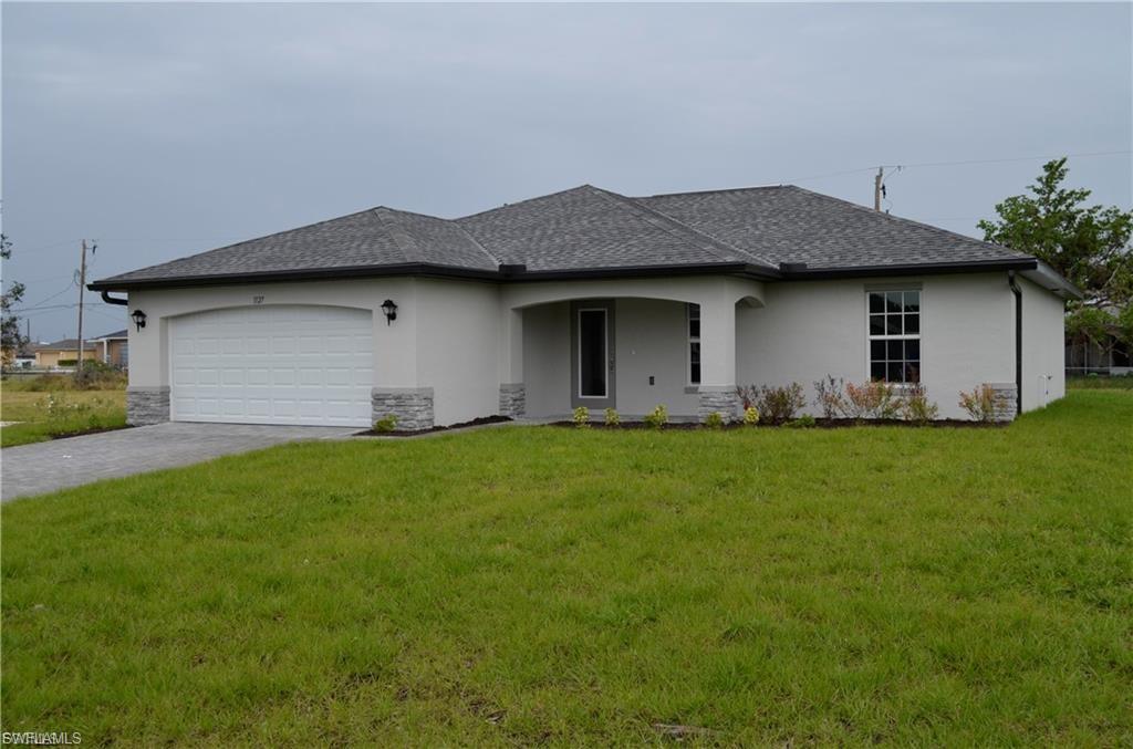 Beautiful 3 bedroom plus den home 2 car garage Greatroom floor plan with cathedral ceilings and center island kitchen with stainless steel appliances, Spacious living room leads to large covered lanai to enjoy the SW Florida lifestyle! Features Include: CBS construction, high efficiency AC system, Moen plumbing fixtures, PGT Low E Insulated windows, 36” upper cabinets with soft close doors, granite counters in kitchen and bathrooms, stainless steel kitchen appliance package, colonial style raised panel doors, electric garage door opener, tile flooring in main living areas, stone accents on front elevation of the home, irrigation system, Epoxy coated garage floors, upgraded to paver driveway. Lawn care is included in the rent