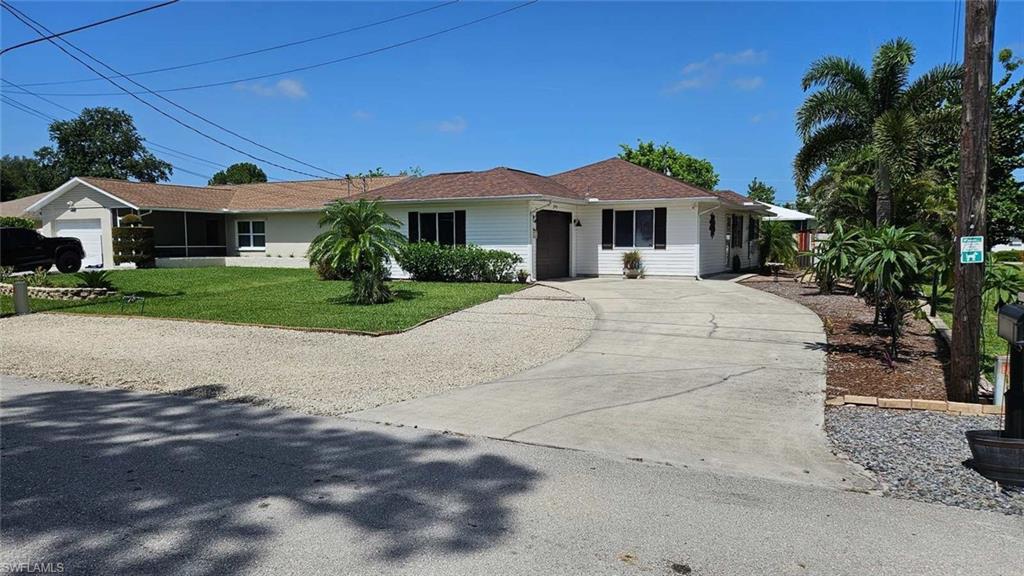 Priced to sell!  Charming 3 br 2 ba with one car garage that's almost completely furnished!  Seller has tastefully decorated this home and the landscaping really makes this home sparkle!  Close to downtown Old 41, shopping, entertainment and minutes from the beach.  Perfect for investors and first time home buyers!  New AC 01/2024, new roof 12/2017, new electrical panel 01/2022.  All the major replacements are done!