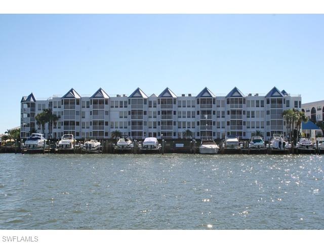 Fantastic views from this nicely updated condo with a 46 ft dock.  Minutes to the Gulf with deep water direct access. Plenty of storage, electric shutters on screened porch.  Walking distance to restaurants and shops.
