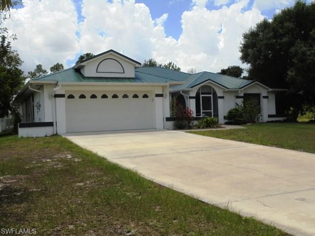 Beautiful property in Buckingham. 8.29 Acres with pond and fish. Metal barn with 2784 sq ft and 3 garage doors. Solar heated pool, screened lanai under truss. 3/2, split floor plan. Master has walk in closets, separate jacuzzi tub and walk in shower. Laminate floors, tile and carpet. Metal roof and hurricane shutters. Bring your horses and cattle and live the country life.