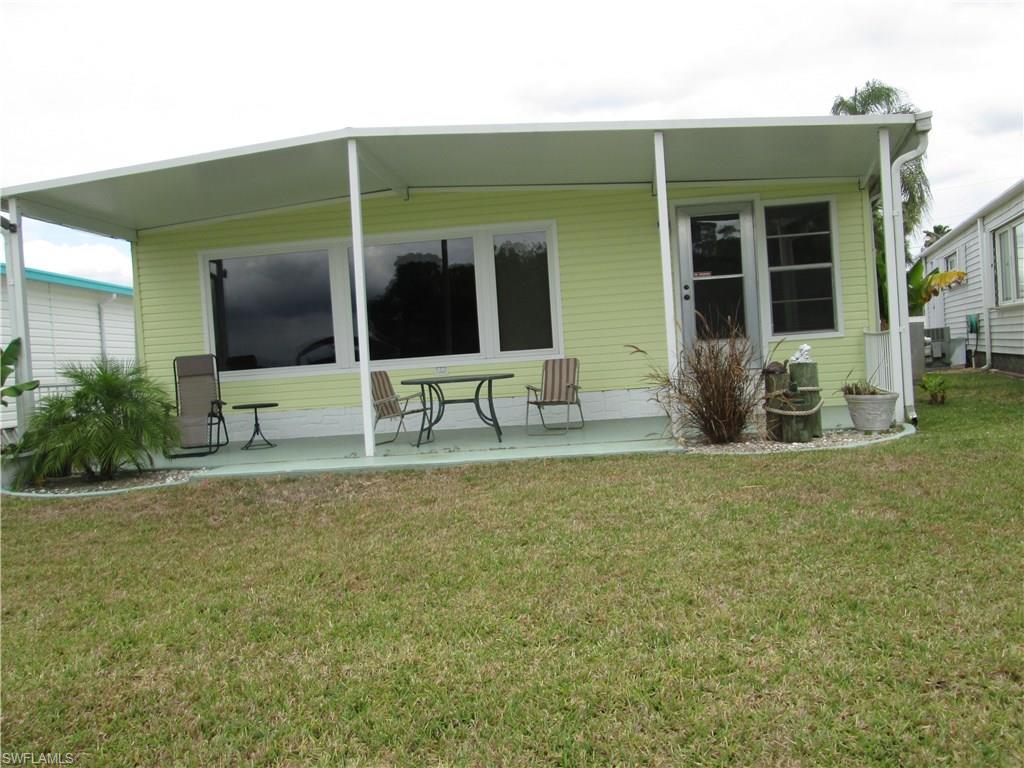 Home has been recently remodeled and is on the Caloosahatchee river. Dock is composite decking and has a
space and posts for a lift, if desired. Water and electric to dock. New refrigerator in 2017-- all new laminate
flooring. Monthly maintenance fee includes water and sewer, lawn mowing, edging, garbage pick up and the use
of all amenities in the park. Price includes the share for the lot and ownership in the co-op.   Great view of
the river and an outside covered patio included.