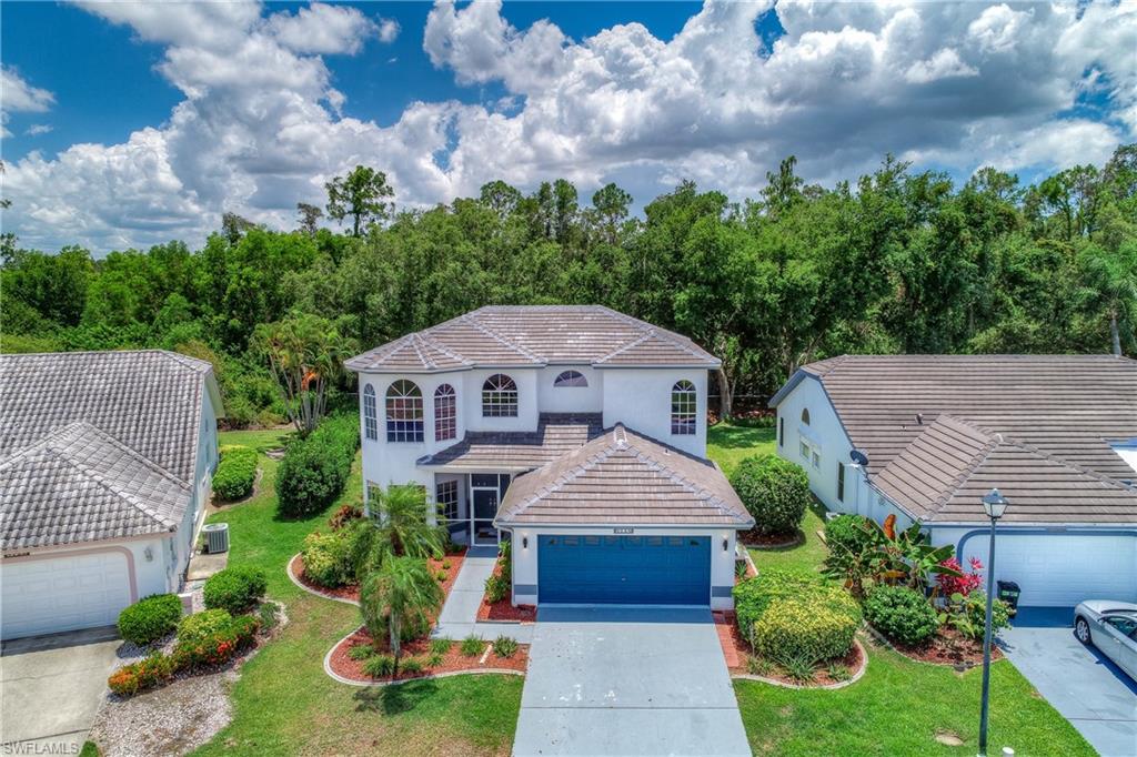 Take a moment to schedule your appointment, to view this one of kind, sprawling 2 story Estate home, located in the highly sought after gated community of -Cross Creek Estates.  Boasting over 2100 SqFt of living space, this 3 bedroom + den (can be used as a 4th bedroom), 2.5 bath, luxurious upgraded Estate-  offers you: A new $30,000 tile roof, a new, completely remodeled, state of the art, eat in, chef's kitchen- with formal dining and breakfast nook, wood plank tile flooring downstairs, exotic, espresso stained, bamboo flooring upstairs, and 2 1/2 completely remodeled, modern style bathrooms. This beautiful home is magnificently landscaped, very private- and sits on one of the only preserves in the community.  The back, screened-in lanai, is cozy and quiet-  perfect for relaxing after a long day! Be within a short distance to the world renowned, SWFL international airport- and best of all- be centrally located to all the shopping, food, fun and pristine, blue water Gulf Beaches, that SWFL has to offer.