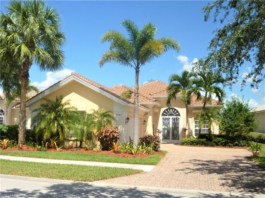 OVER 70K IN RECENT UPGRADES! BRAND NEW ROOF! ELECTRIC SHUTTERS! NEW LANAI SCREEN & REINFORCED SCREEN CAGE! 1 YR. OLD HOT WATER HEATER & APPLIANCES!  2 YR.OLD A/C!  EASILY ACCESSIBLE PULL OUT PANTRY DRAWERS! NEW MASTER BEDROOM CARPET!  LAKE VIEW!  EXTENDED LIVING AREA!  EXTENDED LANAI!  This 3/3+den is one of the best values in the community.  Walking distance toTown Center & amenities (just 7 houses away); professionally landscaped; gorgeous lake view; granite countertops in kitchen and bathrooms; tile through main living areas with carpeted bedrooms; spotlessly clean - this extended Oakmont model with extended screened lanai won't be on the market for long.  Amenities include tennis, fitness center, putting green, resort & lap pools, boccie courts, post office, gas station & car wash, restaurant, nail salon & beauty parlor, game rooms, library, and miles of walking/biking trails.  Close to all that Naples has to offer including those sugar sand beaches.  Professional Management & Social Director with varied activities and clubs and all with low HOA dues.  This could be your piece of Florida paradise.  Come take a look - you'll know you want to be here!