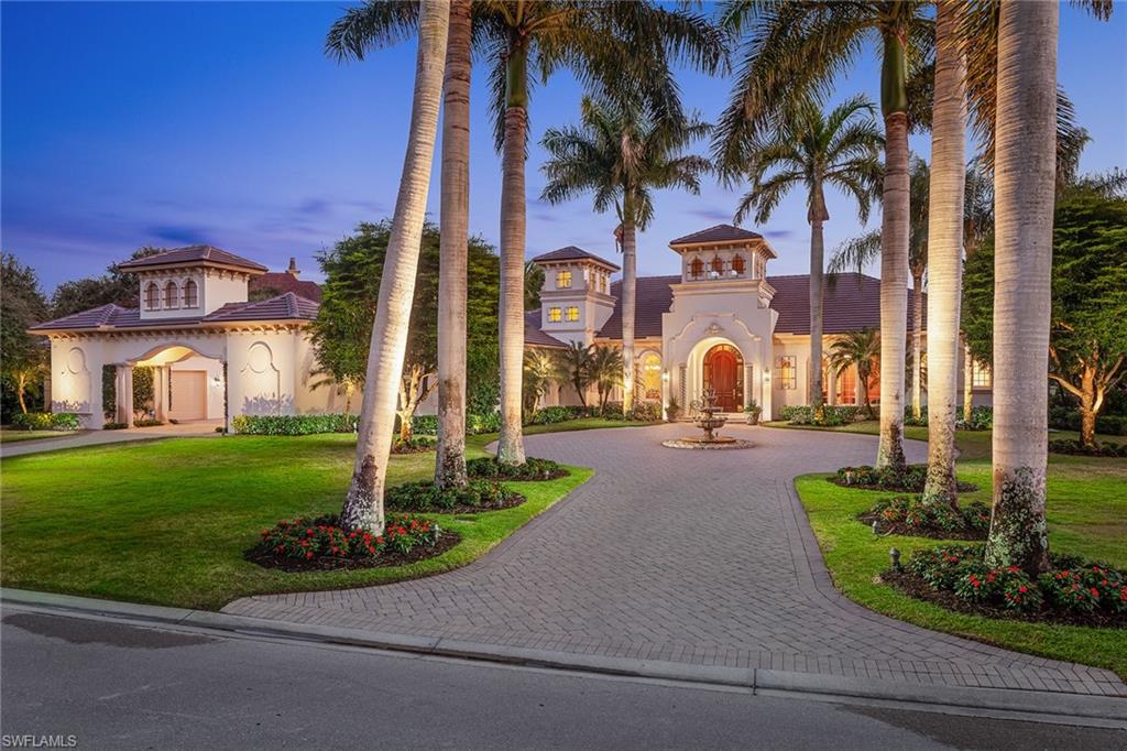 Located in the exclusive Isle Royale community in Grey Oaks Country Club, this sprawling custom estate home is sited on a private and peaceful waterfront lot. Well-appointed and gracious, the home was designed for personal enjoyment and entertainment. It features a new roof, studio off the courtyard, motor court with garages for three cars, golf cart and storage room, covered dining lanai with summer kitchen, expansive caged pool area, intricate ceiling details, wood-paneled office, luxurious master suite with dual baths and built-in closets. Grey Oaks is an award-winning club with amenities, including three golf courses, a 30,000-square-foot wellness center, active tennis, fitness and social programs. Old Naples, fine dining, the beaches, and international and private airports are easily accessible.