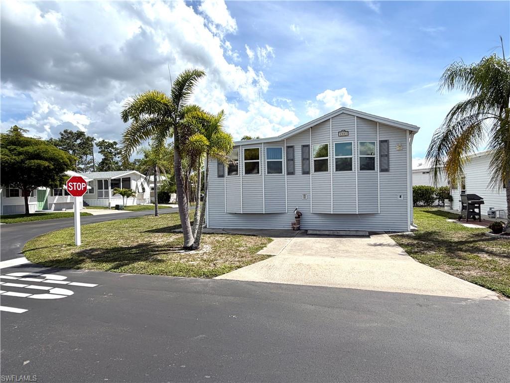 Welcome to your new oasis in Riverwoods Plantation, a vibrant 55+ community where you own the land! This delightful two-bedroom, one and a half bathroom home has a newer roof and air conditioning, ensuring comfort and peace of mind. Situated on a spacious corner lot, you'll enjoy ample outdoor space while being conveniently located near the clubhouse and activities.

Riverwoods Plantation offers an active lifestyle with a variety of amenities. Join your neighbors for exciting games of pickleball, shuffleboard, horseshoes, and bocce ball. Engage in friendly sand and water volleyball matches or challenge friends to a game of billiards. With numerous clubs and events, including dances, breakfasts, and guest speakers, there's always something fun happening in the community!

For those who love the water, residents have access to stunning riverfront property, where you can bring your water toys, kayaks, and canoes. Launch your boat from the ramp on the Estero River, leading you to the beautiful Estero Bay and the Gulf of Mexico.

Conveniently located close to the airport, sandy beaches, and an array of restaurants, this is an ideal spot for relaxation and enjoyment. Don’t miss the opportunity to make this charming property your home in Riverwoods Plantation!