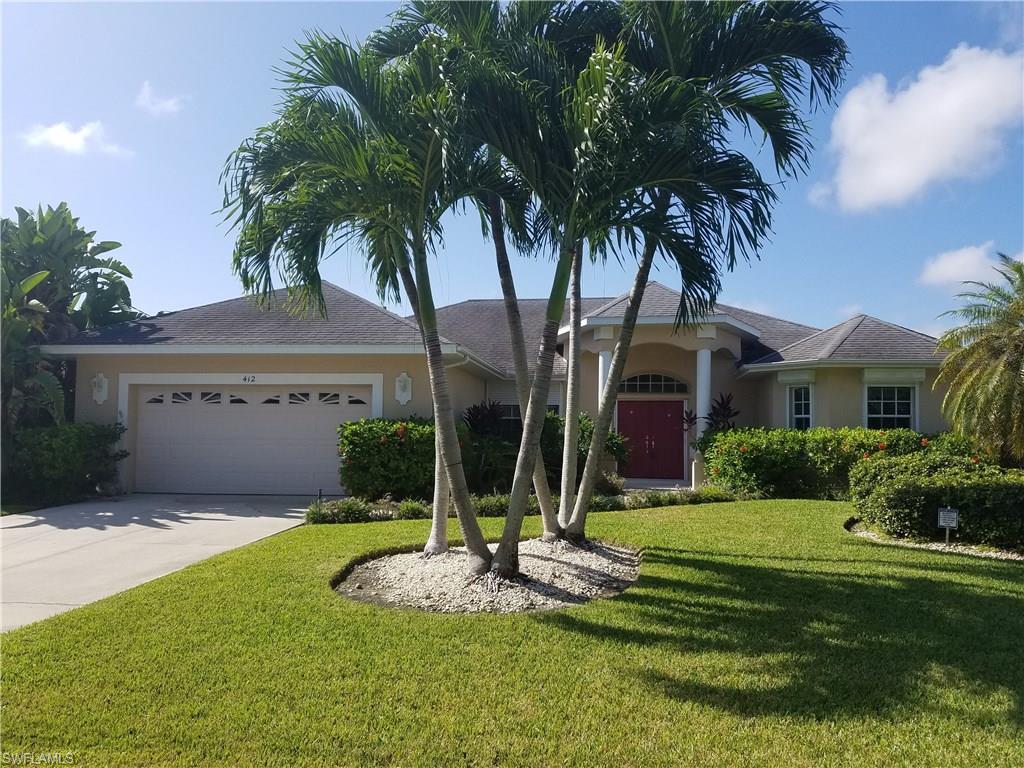 This large Gulf access pool home is ready for your family!    This home is move in ready with 2 master bedrooms, and a very large den that could be a 4th bedroom.   Huge great room with great built ins.  Large eat in kitchen overlooks the water and pool.  The lanai area has beautiful pavers and includes a hot tub.  There are extra solar panels for cooler weather! The large boat dock has a 7,000 lb boat lift.  AC has just been upgraded! Make an offer today!