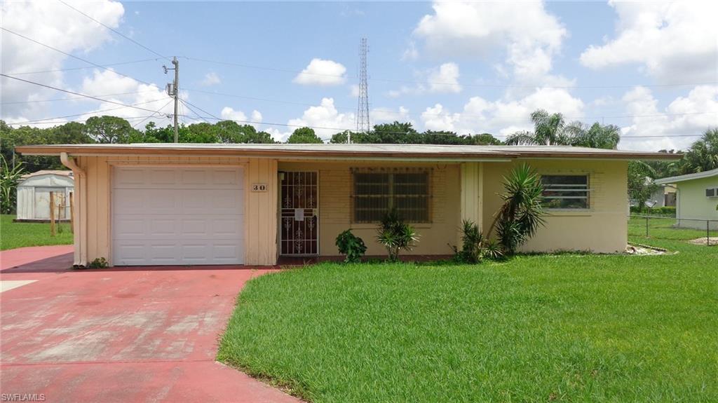 Great North Fort Myers neighborhood located off of 41. Close to the river, beaches, shopping, downtown and much more. Spacious yard. Extra parking space. Formal living room, family room, and dining room.