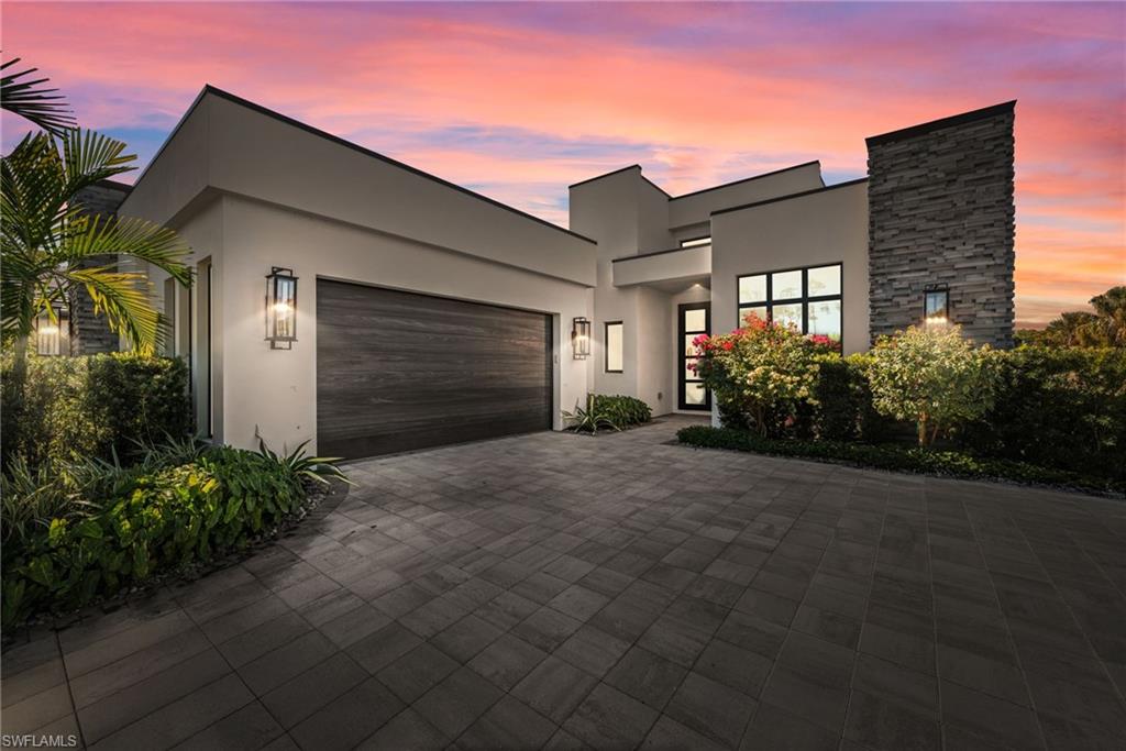 Set along the 2nd fairway of the Miromar Lakes Golf Course, this impeccably designed residence offers a turnkey opportunity within Messina, the newest gated enclave of Miromar Lakes Beach & Golf Club. Originally crafted as a Divco Homes model, the home reflects a level of architectural detail, finish, and flow that is both intentional and enduring. Spanning over 2,900 square feet, the thoughtfully designed floor plan includes four bedrooms, three full baths, and two half baths, balancing openness with privacy. A striking barrel-ceiling foyer creates an elegant sense of arrival, leading into light-filled living spaces finished with engineered hardwood flooring, refined ceiling details, and expansive impact resistant glass sliders that frame tranquil golf course and water views. The kitchen is both elevated and functional, appointed with KitchenAid stainless steel appliances, a natural gas cooktop, two tone cabinetry, and a generous workspace designed for effortless entertaining. Living and dining areas transition seamlessly to the outdoors, embracing the home’s western exposure and capturing sunset light across the fairway. Outdoors, the expansive under-truss lanai is designed for year-round enjoyment, featuring a resort-style pool and spa, an outdoor grilling area, and a dedicated pool bath, making it the perfect place to enjoy Southwest Florida's beautiful weather. The owner’s suite and guest accommodations offer serene, well-appointed spaces that echo the home’s refined aesthetic. Offered fully furnished, the residence allows for immediate enjoyment with no detail overlooked. Residents of Messina enjoy access to the award-winning Miromar Lakes lifestyle, consistently ranked the #1 Community in the United States. Amenities include over 700 acres of freshwater lakes, three miles of private white-sand beach, an Arthur Hills Signature Championship Golf Course, an elegant beach club with dining, full-service spa, state-of-the-art fitness center, pickleball, and more—all within a secure, resort-style setting. A sophisticated expression of golf course living in one of Southwest Florida’s most prestigious private communities.