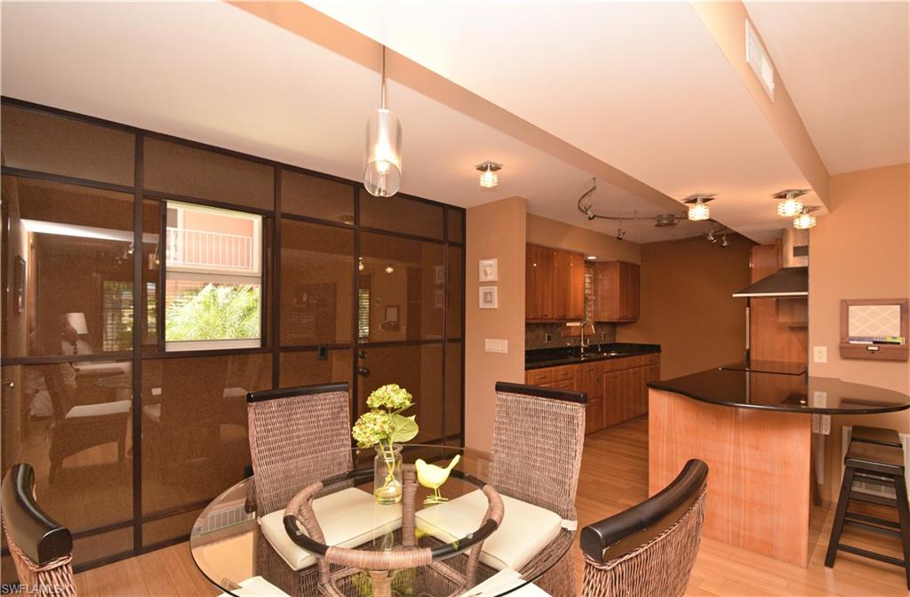 Beautifully upgraded 2-2 in the sought after Gardenia building!  Bamboo flooring throughout. High-gloss, marine finish handmade custom cabinetry in kitchen with black Brazilian onyx countertops and metal black splash.  Clever subzero refrigerator drawer and freezer, with 2nd full-size refrigerator in custom-designed pantry, Thermador microwave, Fisher Pykel dishwasher and Bosch glass cooktop complete this brilliantly designed kitchen! Hunter Douglass plantation shutters throughout, Bosch w/d combo in unit.  New impact windows throughout in 2016, HVAC unit replaced in 2015.  All this within two blocks of Third Street's restaurants and shops and only 5 blocks to the sandy beaches of the gulf!!  Exceptional opportunity!!