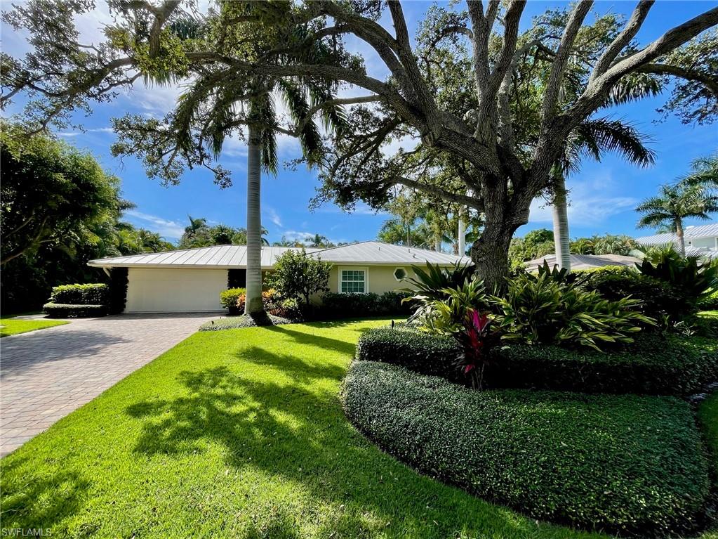 On a peninsula wrapped on three sides by water, surrounded by multimillion-dollar waterfront estates, sits one of the rarest opportunities in Naples. Putter Point Drive is a pocket most people never find — west of Crayton, where the street curves, the noise falls away, and neighboring homes trade in the stratosphere. And here's the rare part: this is the entry point. A ~13,000 SF lot — the one realistic foothold on a street where almost every other lot hosts a 7 to 8-figure home. A coveted south-facing rear exposure means winter sun across your pool deck all day. Renovate and reimagine the current home, or scrape to a clean slate and build the home of your dreams — Minutes from downtown Naples, Waterside Shops, The Village Shops, The private Moorings Beach Club, or a golf-cart cruise to the brand-new Four Seasons and future Rosewood resorts, and you never once have to touch 41. While the current structure was impacted by Hurricane Ian, the drywall was fully abated to the ceiling and studs, and the structure was proactively treated to prevent mold growth.  The roof is a standard seam metal roof that was not damaged in the storm.  This property is being sold "as is" and is most likely a vacant land sale. Seller is a licensed real estate agent in the State of Florida.