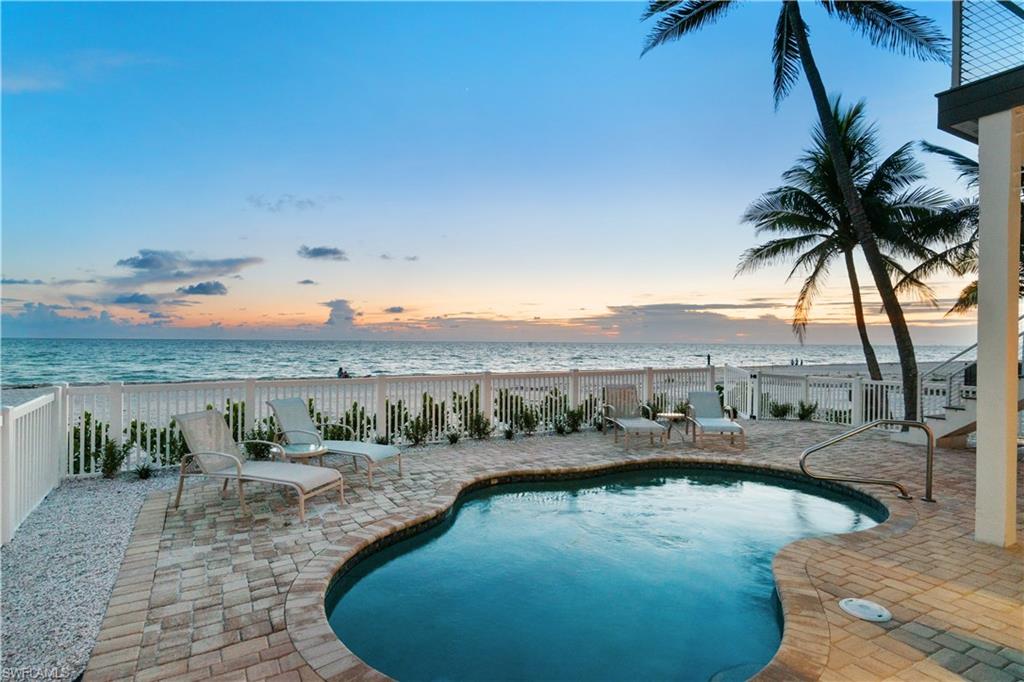 ONLY DIRECT BEACHFRONT HOME UNDER $10M AVAILABLE ON BONITA BEACH! BEST BEACHFRONT VALUE IN ALL SWFL. Beautifully maintained & updated coastal home with stunning panoramic Gulf views from Naples to Sanibel. Fantastic rental option with no restrictions & estimated potential rental income up to $300k! Delight in the private pool overlooking the magnificent views of the sugar sand beach, coveted Western exposure & spectacular Gulf views from nearly every window. This 4-bedroom home boasts new impact glass windows on the ground floor, tile/wood floors, new Lutron lighting system, new plumbing throughout, lower-level flex space, elevator & a two-car garage with a paved driveway. Light, bright & airy, this home’s kitchen offers quartz counters, stainless-steel appliances & light cabinetry. Beautiful living room balcony is perfect for watching the breathtaking sunsets over the Gulf. Spacious master includes a private balcony & a large sunroom with a sitting area for optimal gulf views. Walking distance to several fantastic restaurants and a 10-minute drive to Mercato and the Promenade, with Waterside Shops, Coconut Point, Naples 5th Ave, and the International Airport nearby.